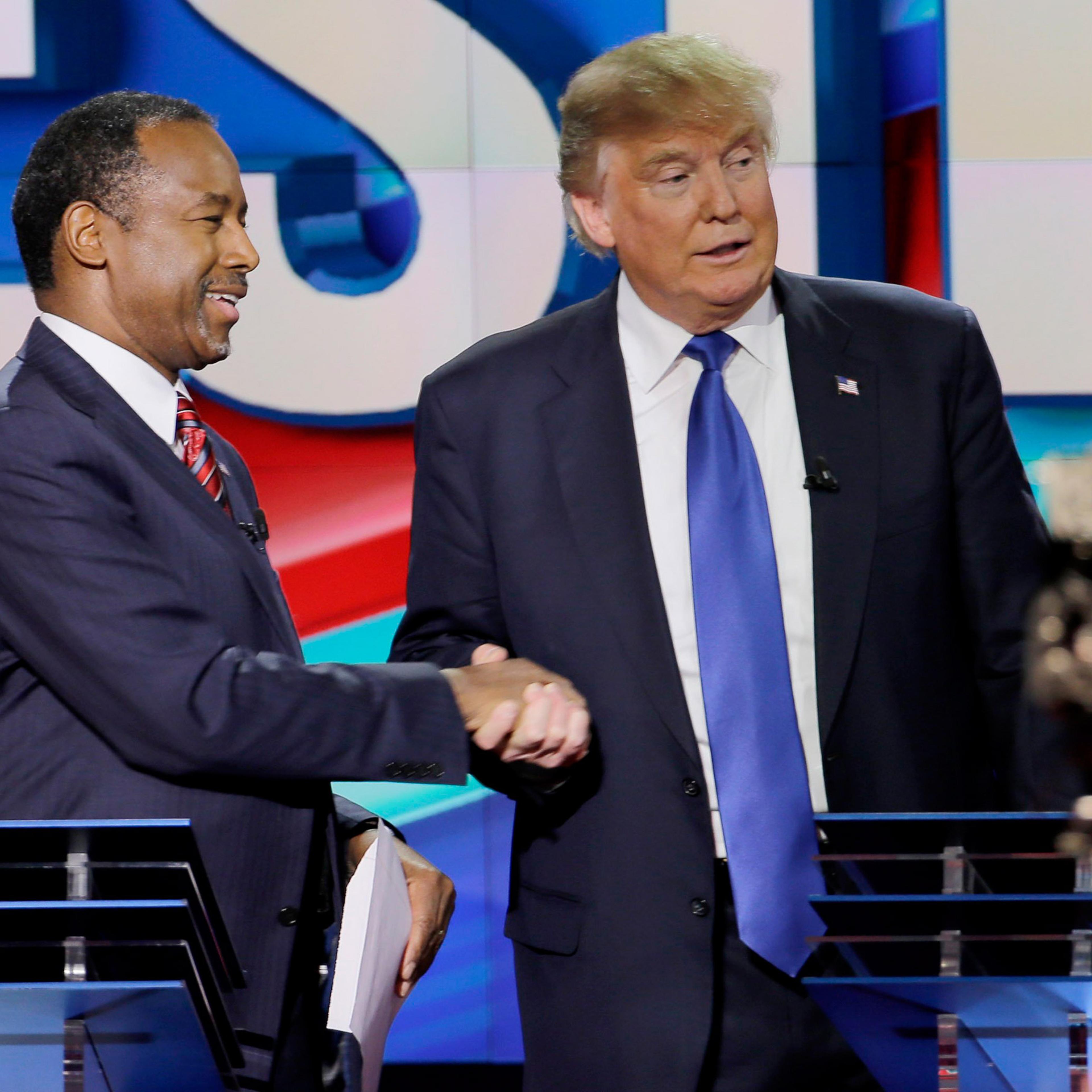 Republican presidential candidate Ben Carson shakes hands with Donald Trump after a Republican presidential primary debate at the University of Houston, Feb. 25, 2016.