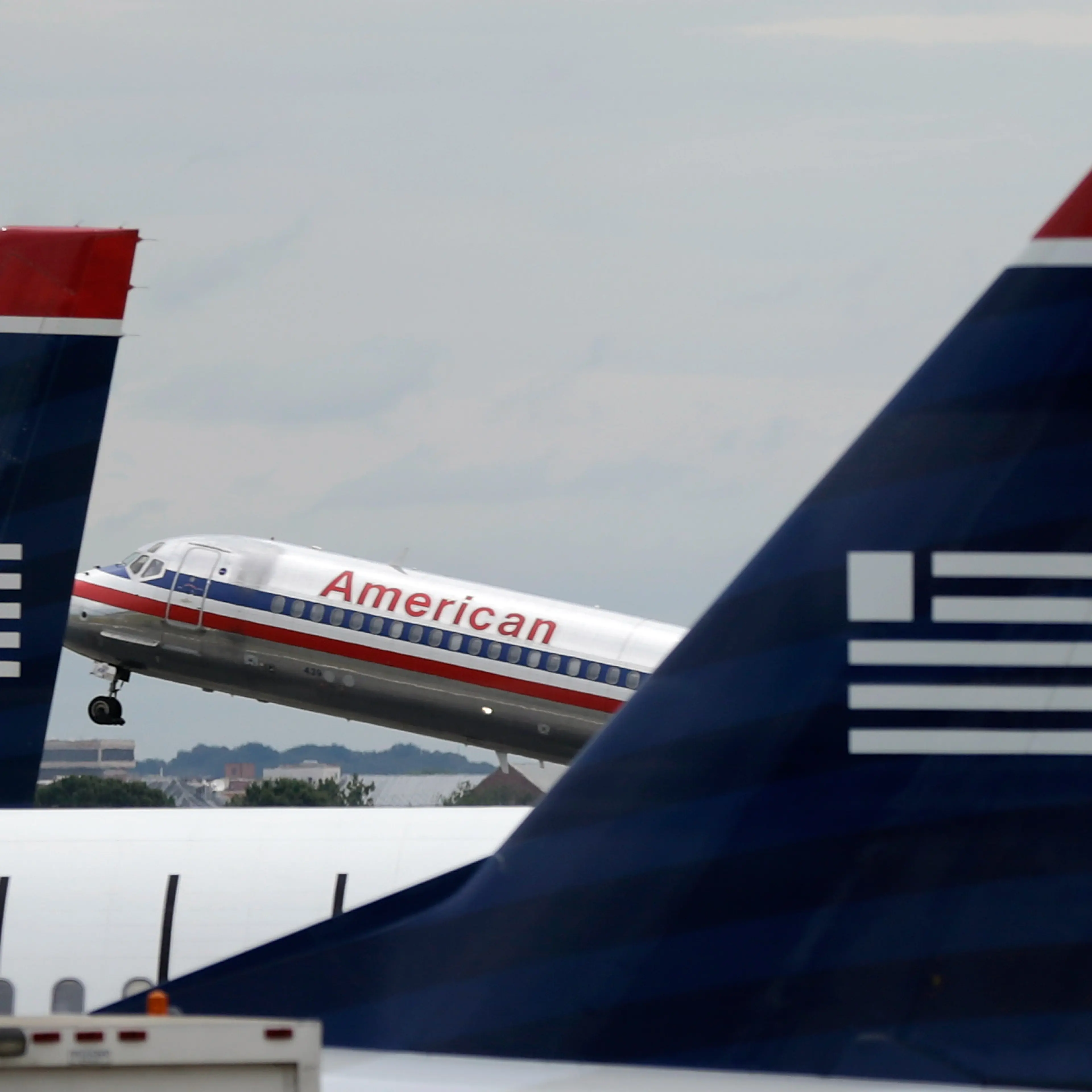 Justice Department Files Suit To Block Proposed Merger Of American and US Airways
