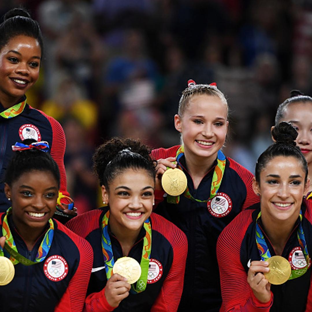Gold Medalists Gabrielle Douglas, Simone Biles, Lauren Hernandez, Madison Kocian and Alexandra Raisman of the United States pose for photographs on the podium at the medal ceremony for the Artistic Gymnastics Women's Team on Day 4 of the Rio 2016 Olympic