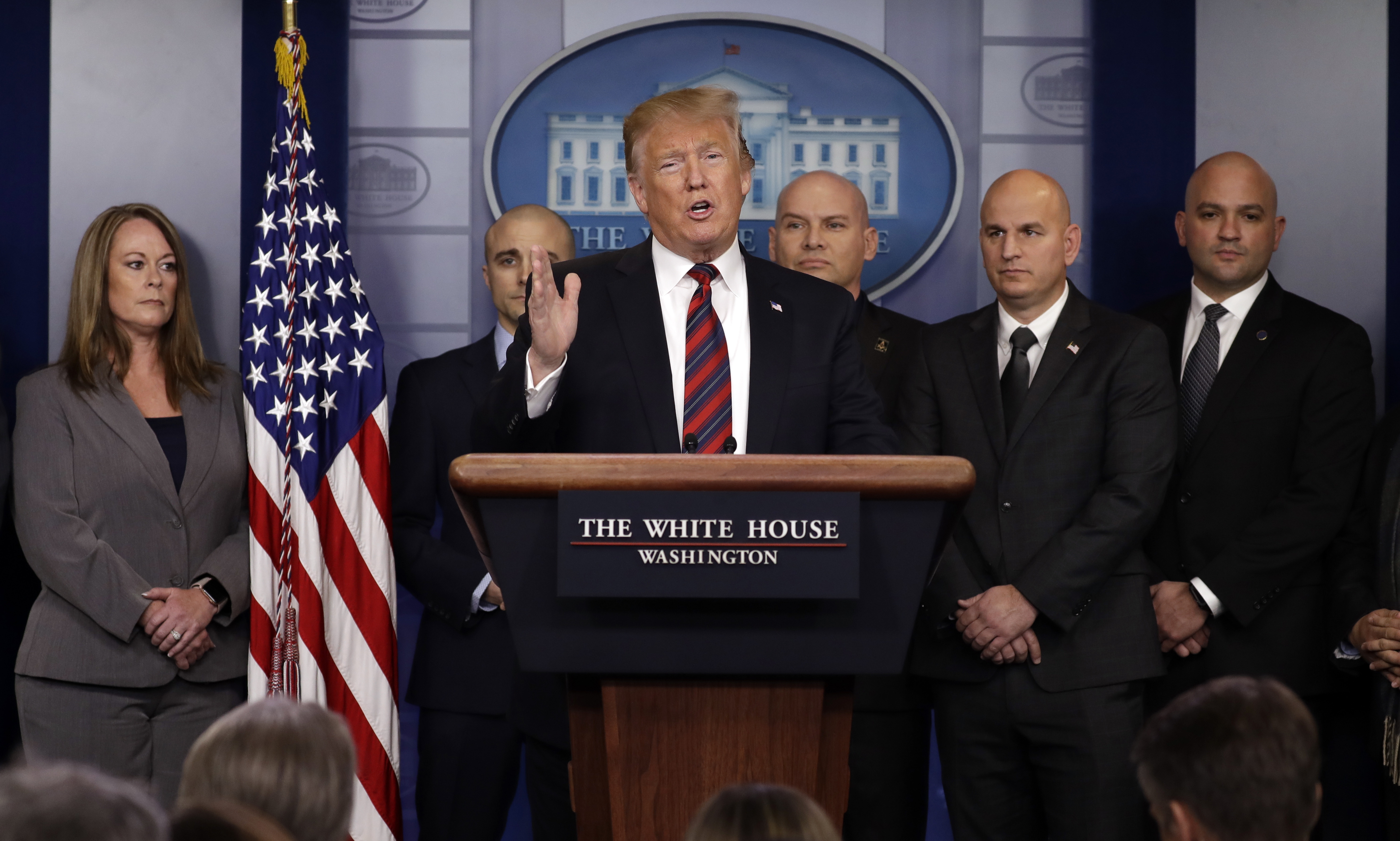 President Donald Trump attends first White House press briefing