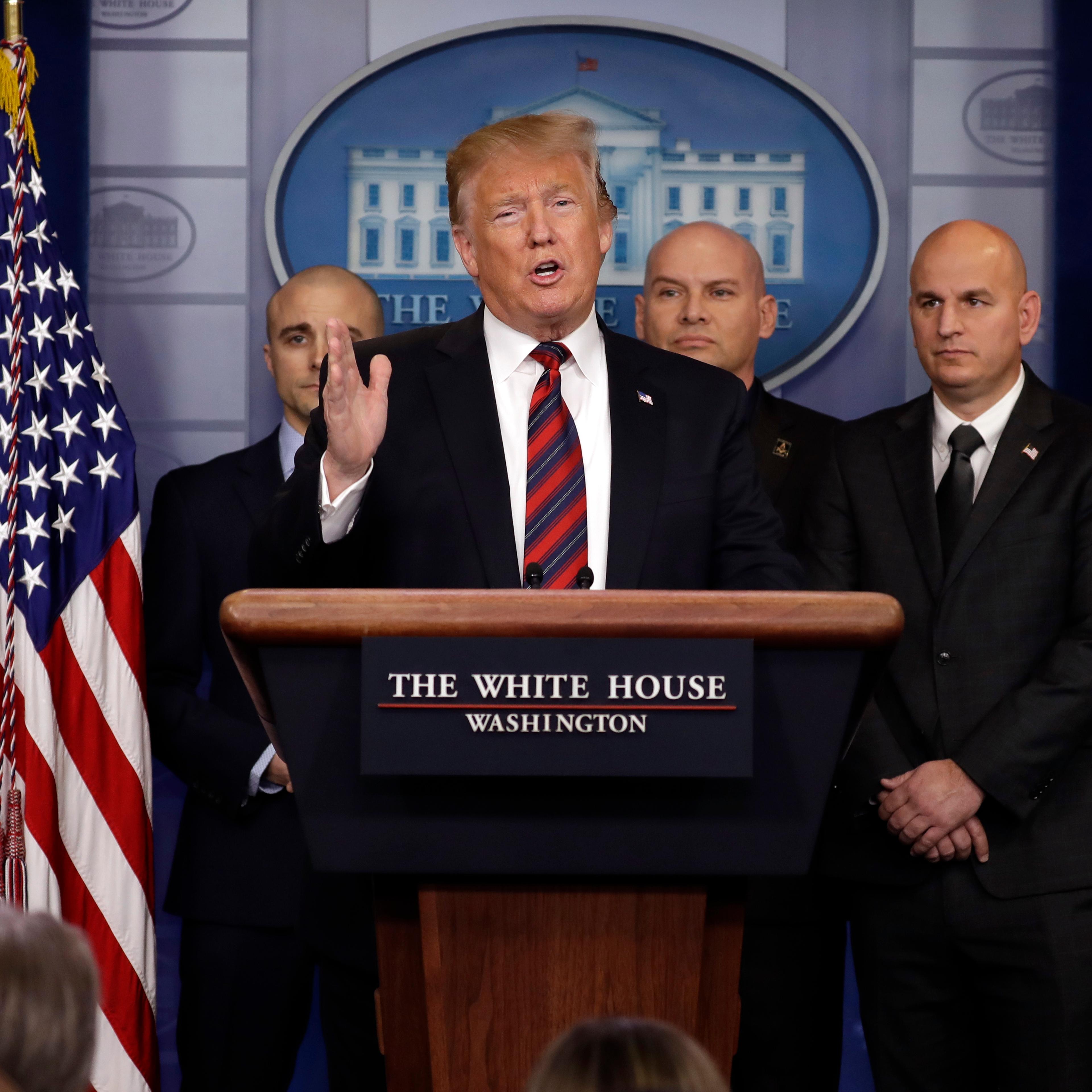 President Donald Trump attends first White House press briefing
