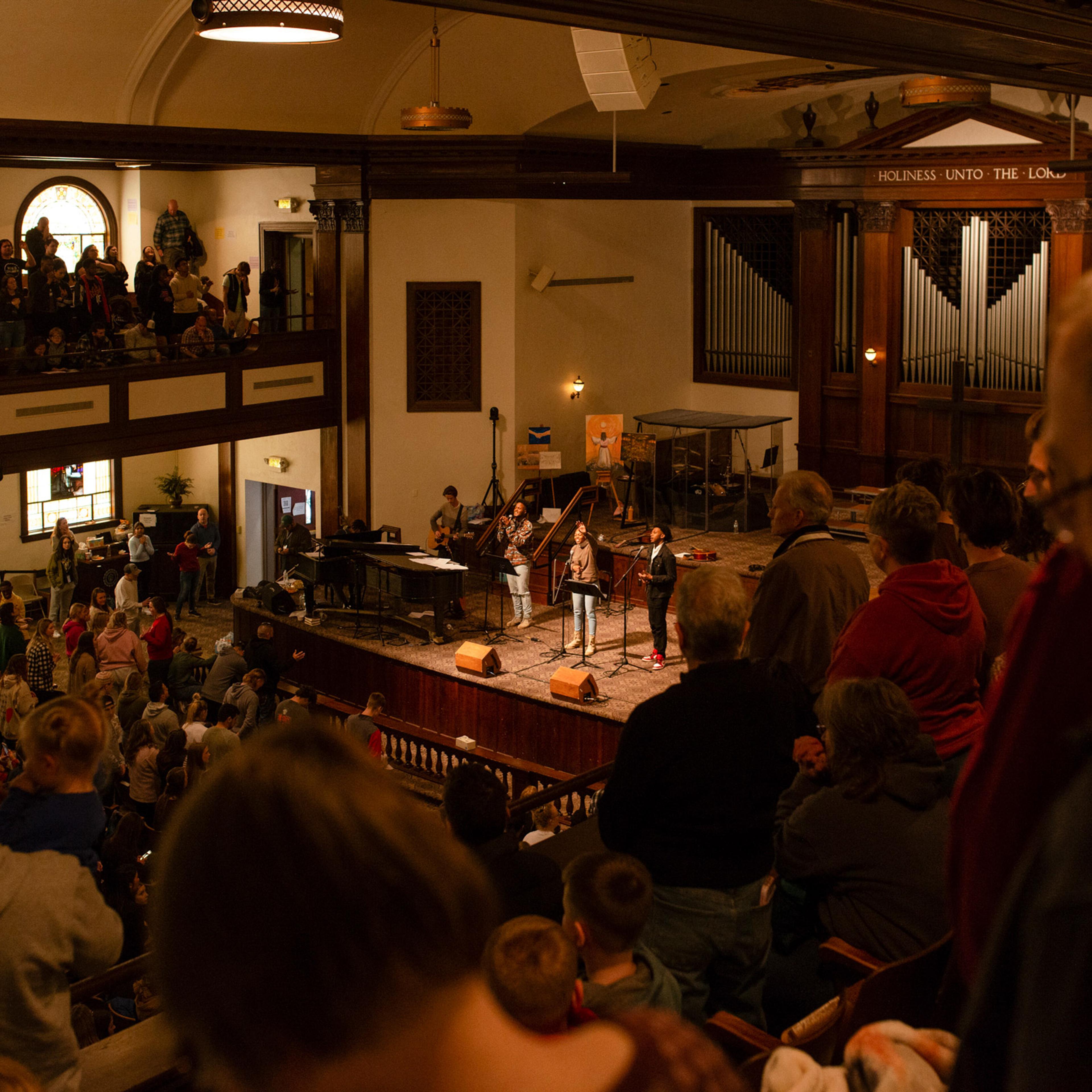 Students leading worship inside Hughes Chapel on the campus of Asbury University in Wilmore, Ky., on Feb. 17, 2023. (Jesse Barber/The New York Times)