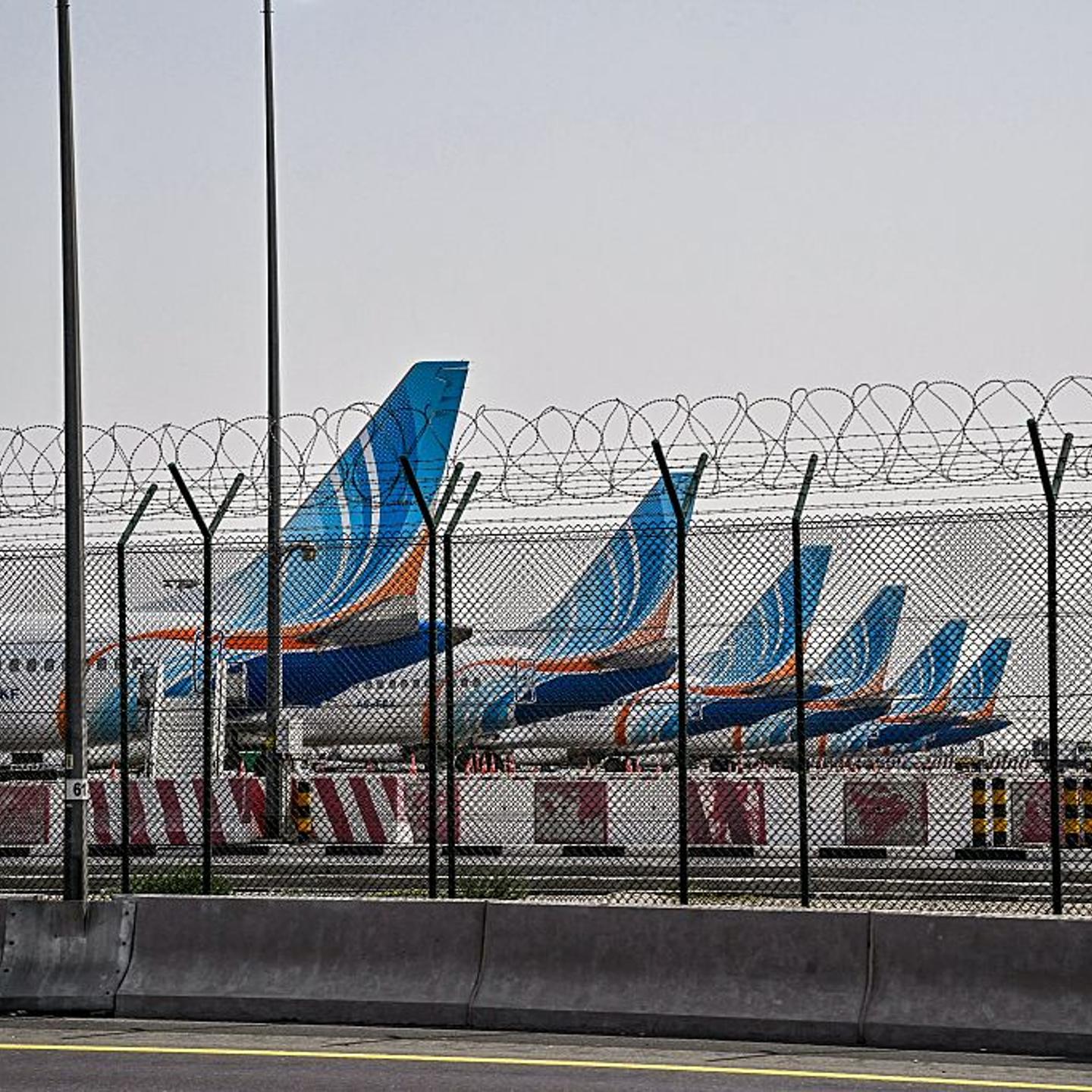 FlyDubai planes are parked on the tarmac at Dubai International Airport in Dubai, United Arab Emirates, amid the U.S. and Israel's war with Iran on March 2, 2026.