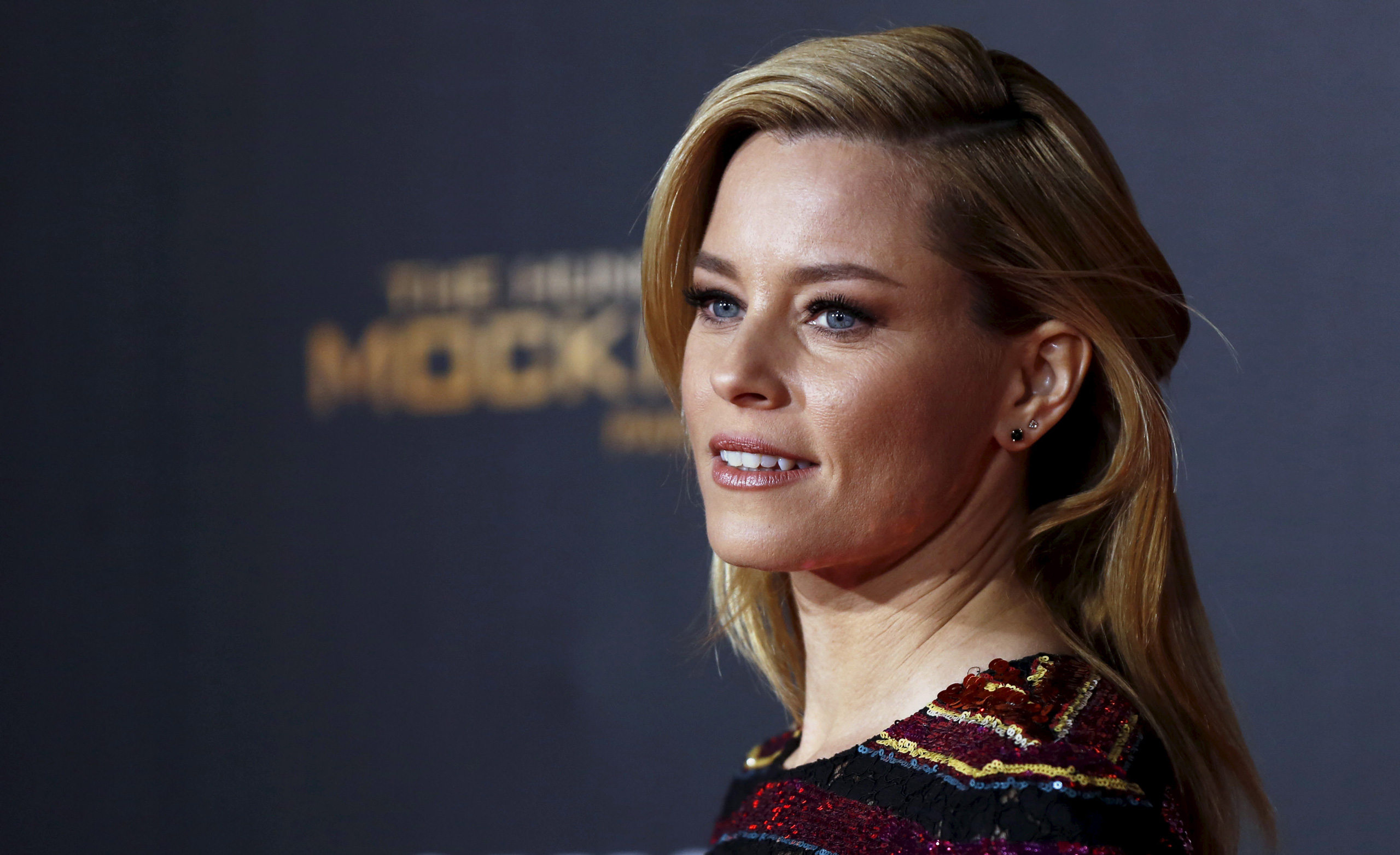 Cast member Elizabeth Banks poses at the premiere of "The Hunger Games: Mockingjay - Part 2" in Los Angeles, California November 16, 2015. The movie opens in the U.S. on November 20. REUTERS/Mario Anzuoni - RTS7H8L