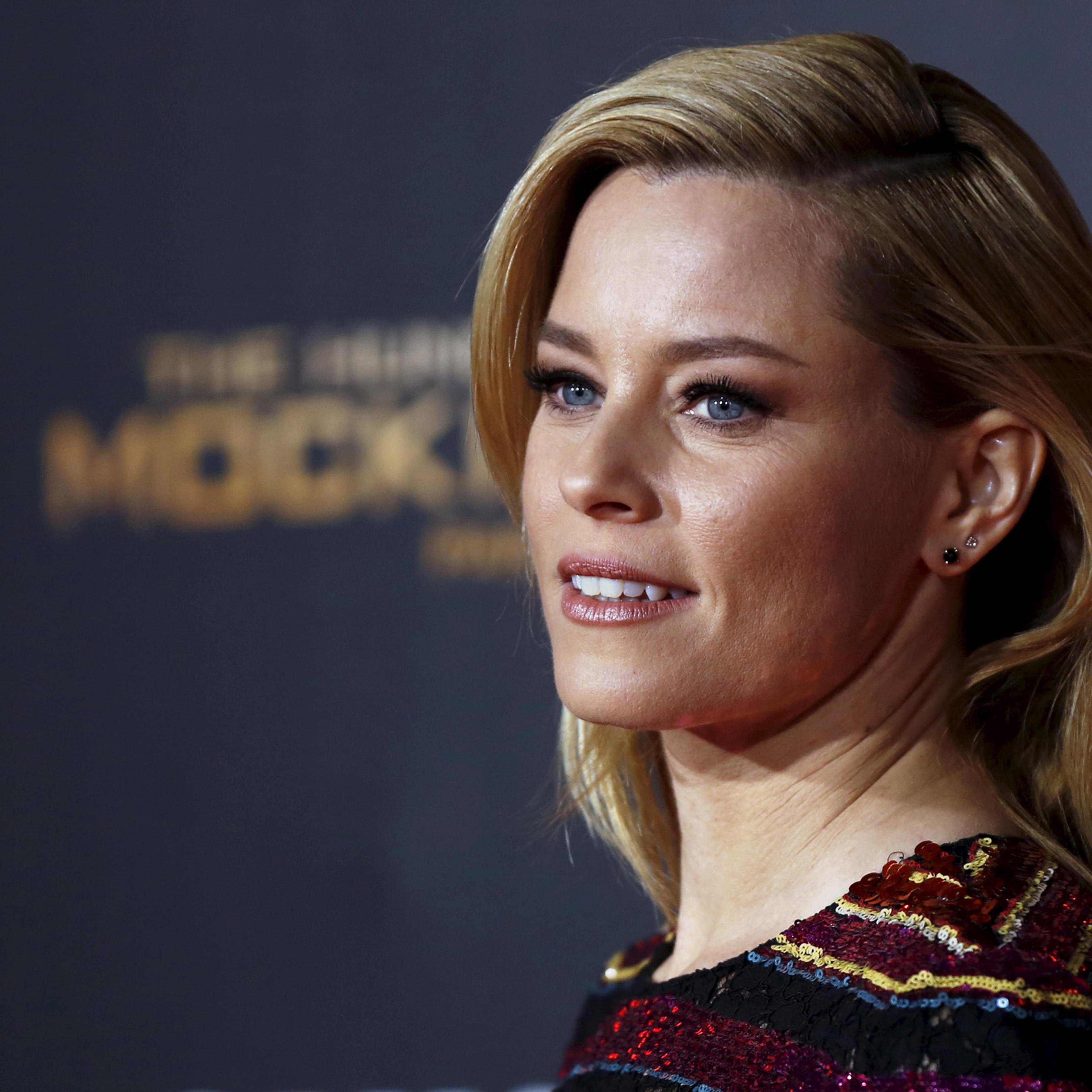 Cast member Elizabeth Banks poses at the premiere of "The Hunger Games: Mockingjay - Part 2" in Los Angeles, California November 16, 2015. The movie opens in the U.S. on November 20. REUTERS/Mario Anzuoni - RTS7H8L