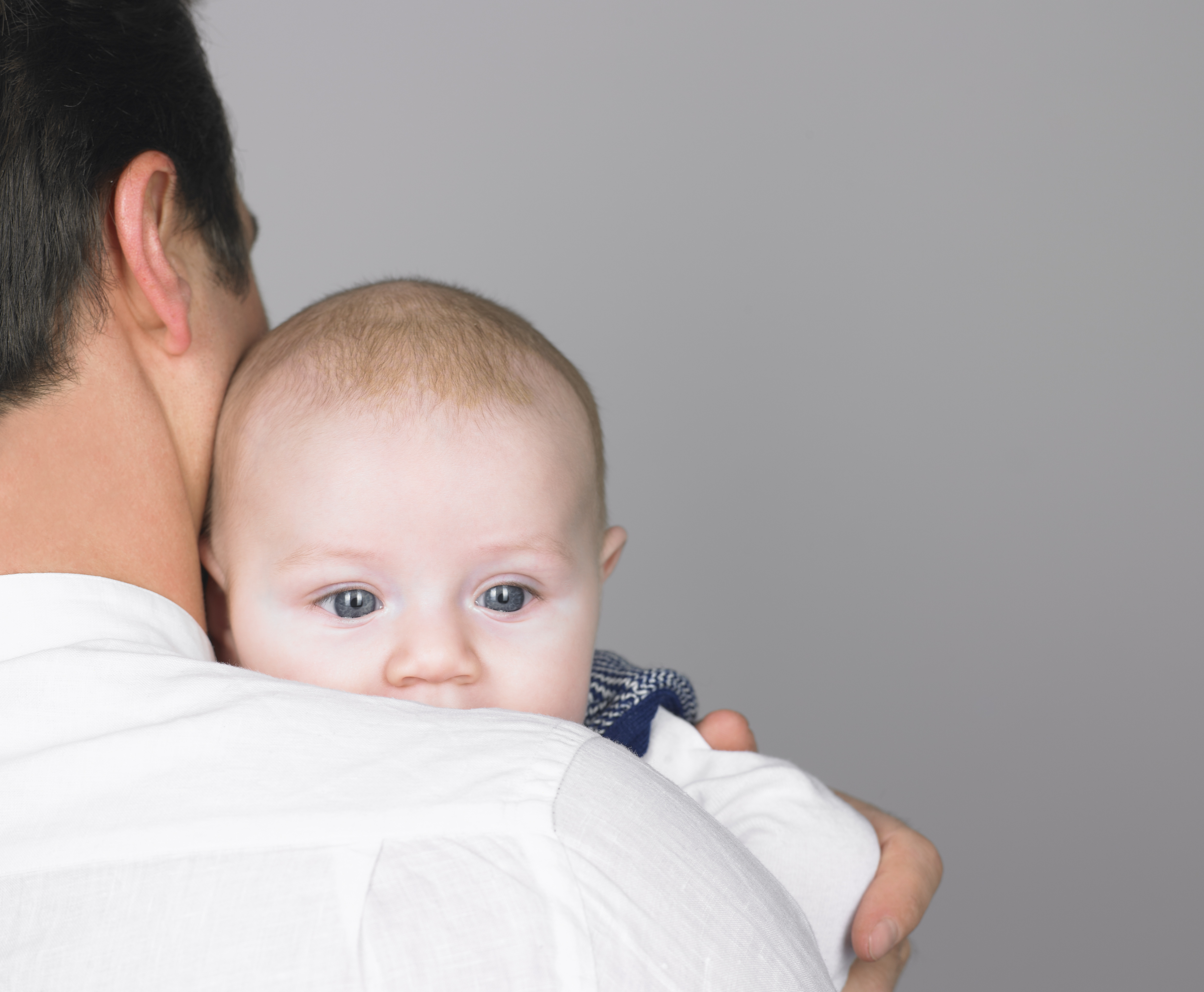 Baby on fathers shoulder