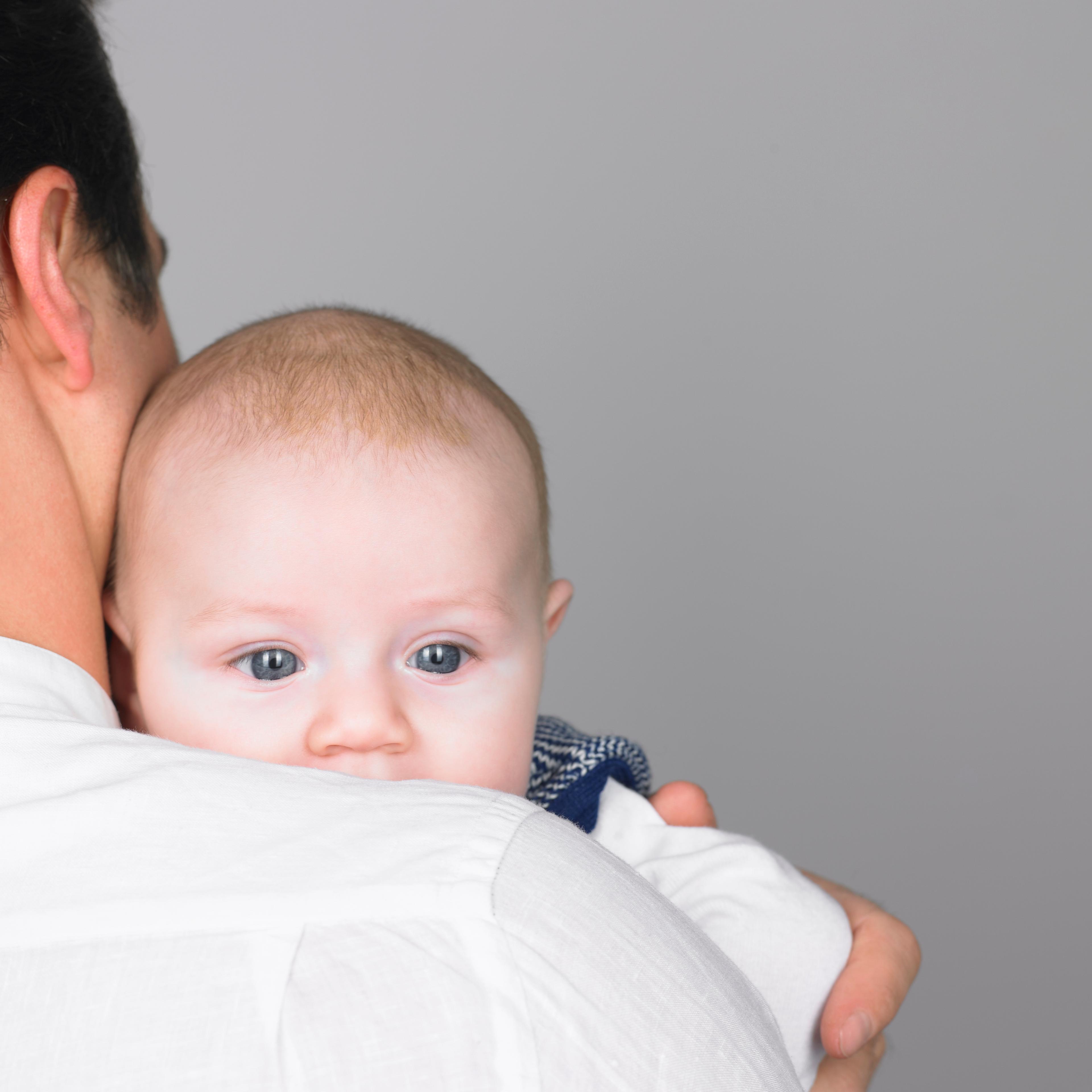 Baby on fathers shoulder