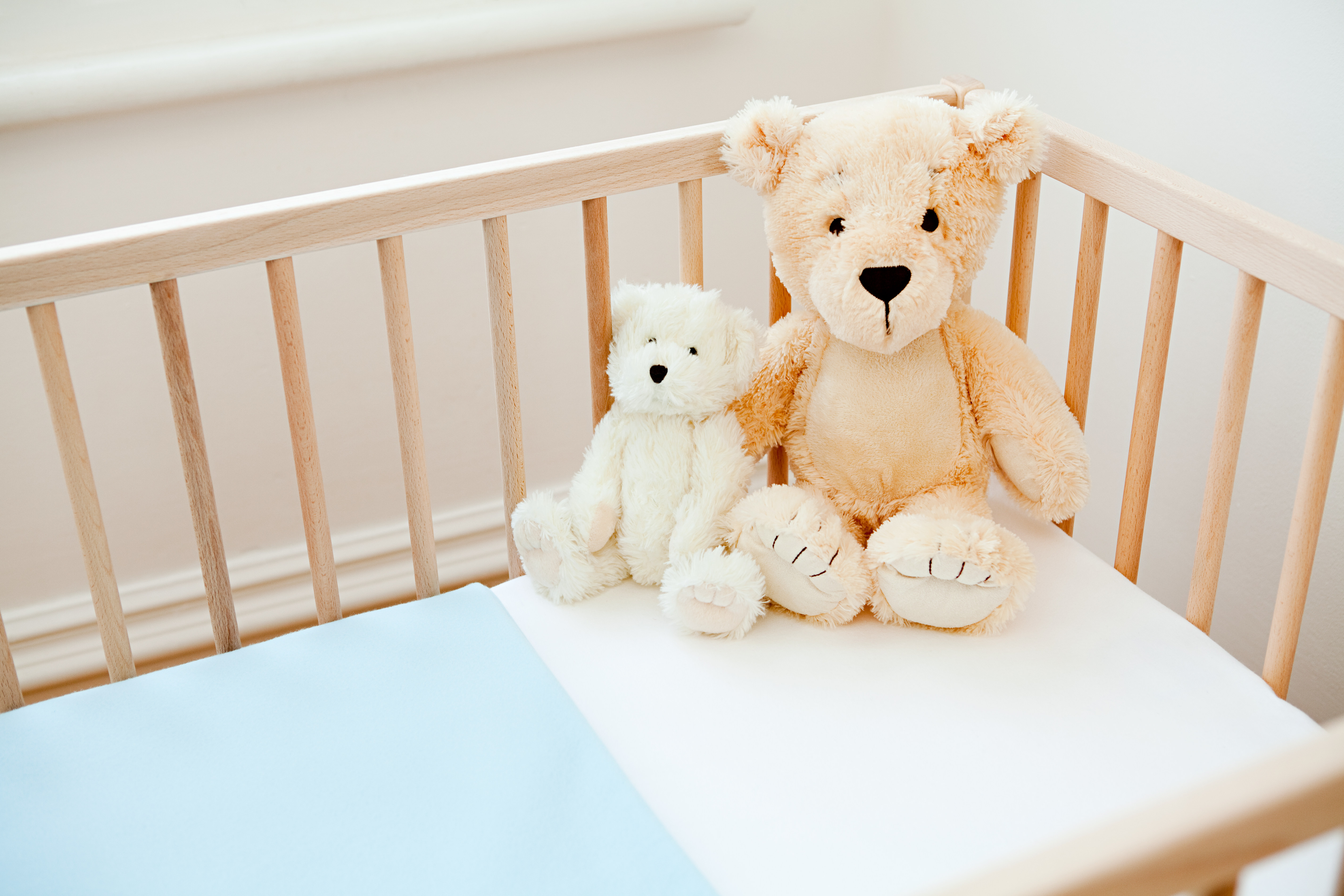 Teddy bears on crib
