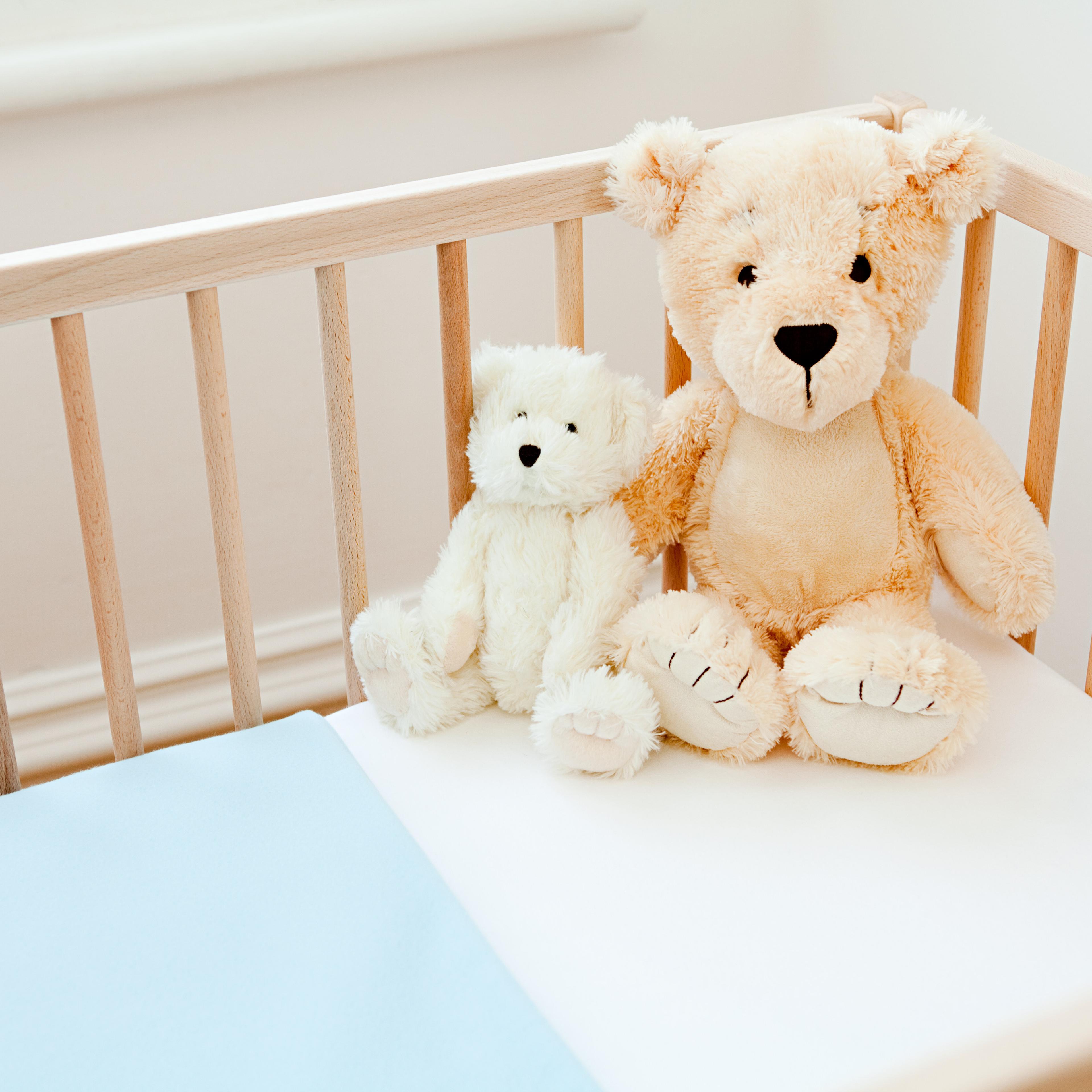 Teddy bears on crib