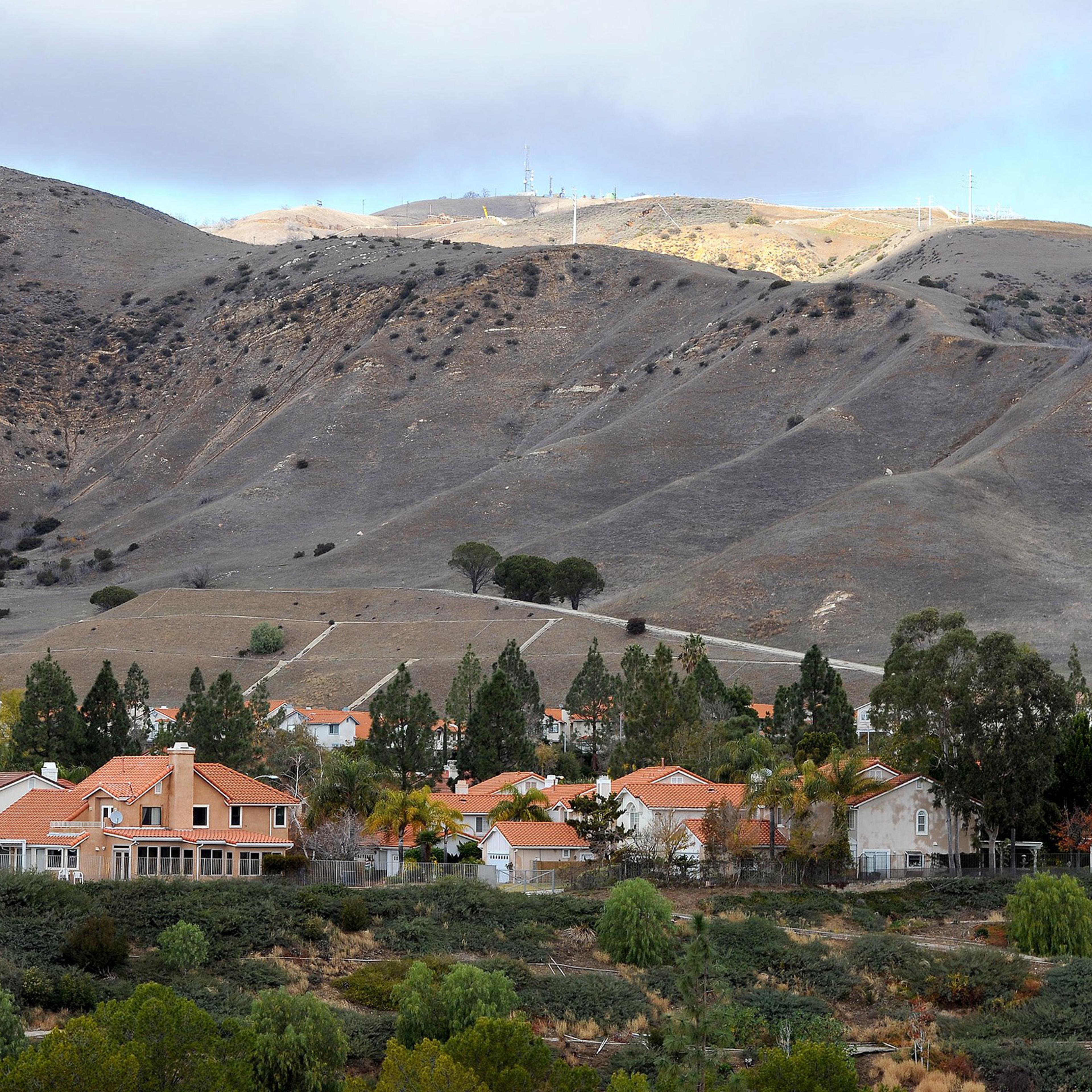 Porter Ranch Estates sit at the foothills near a Southern California Gas Co. gas well that has been leaking methane daily near the community Porter Ranch, Calif., Thursday, Jan. 7, 2016. California Gov. Jerry Brown declared a state of emergency over the
