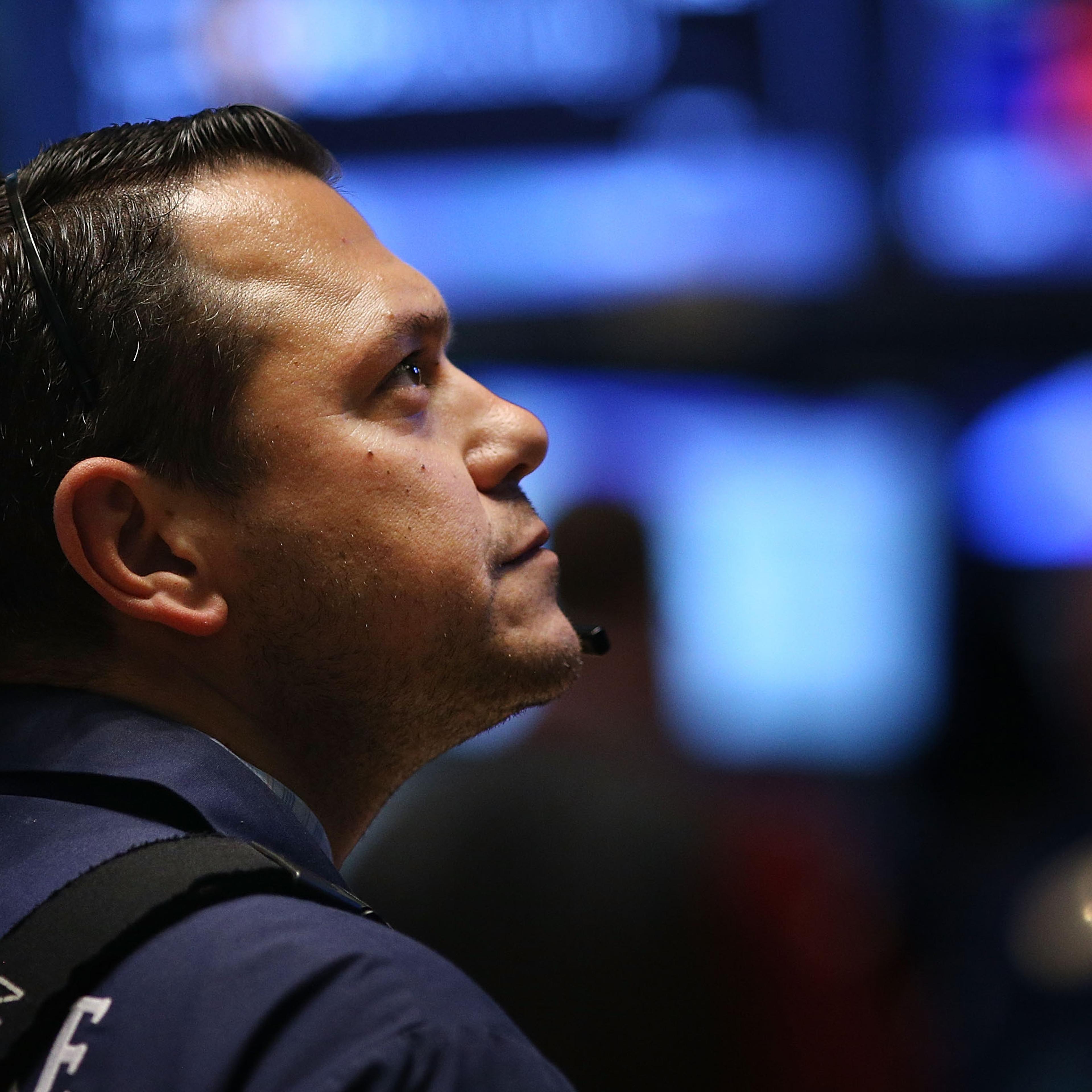 A trader works on the floor of the New York Stock Exchange (NYSE) on Oct. 21, 2014 in New York City.
