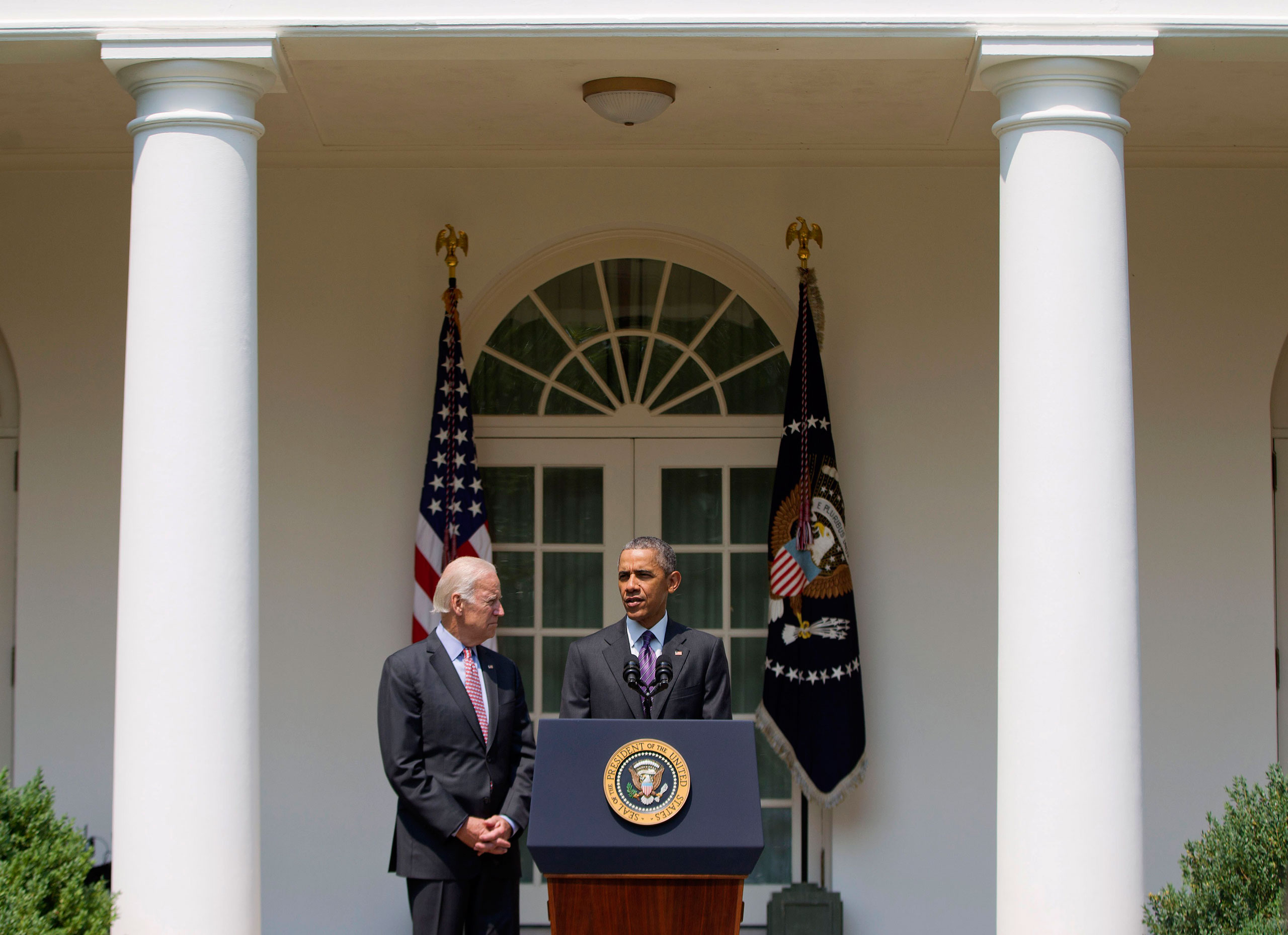 President Barack Obama, accompanied by Vice President Joe Biden, speaks in the Rose Garden of the White House in Washington, Wednesday, July 1, 2015. The president announced that US and Cuba have agreed to open embassies in each other's capitals, the big
