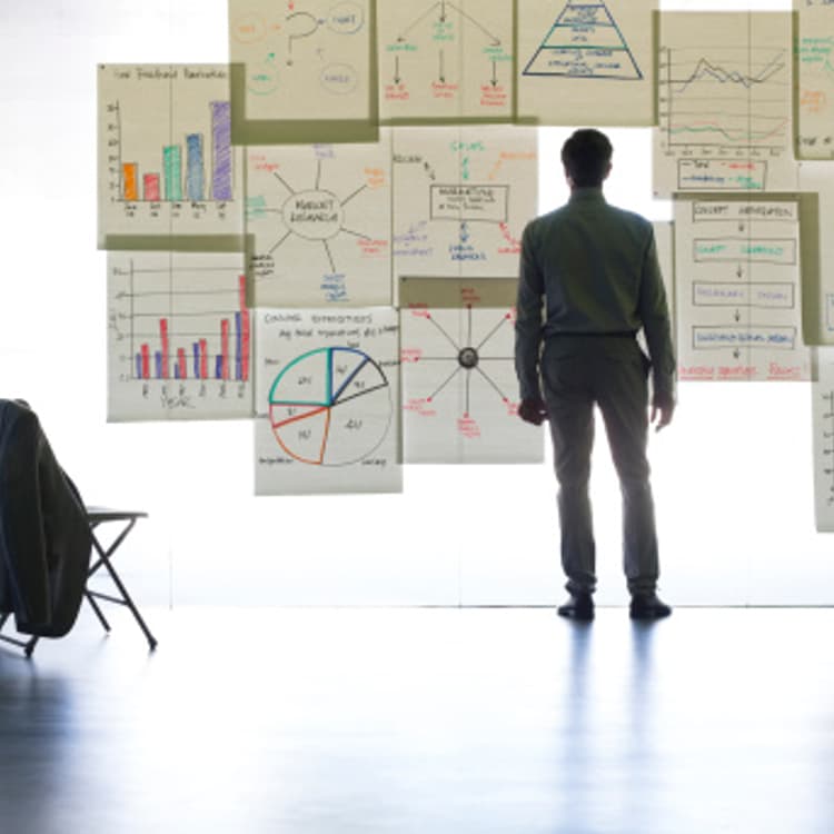 businessman-looking-graphs-charts