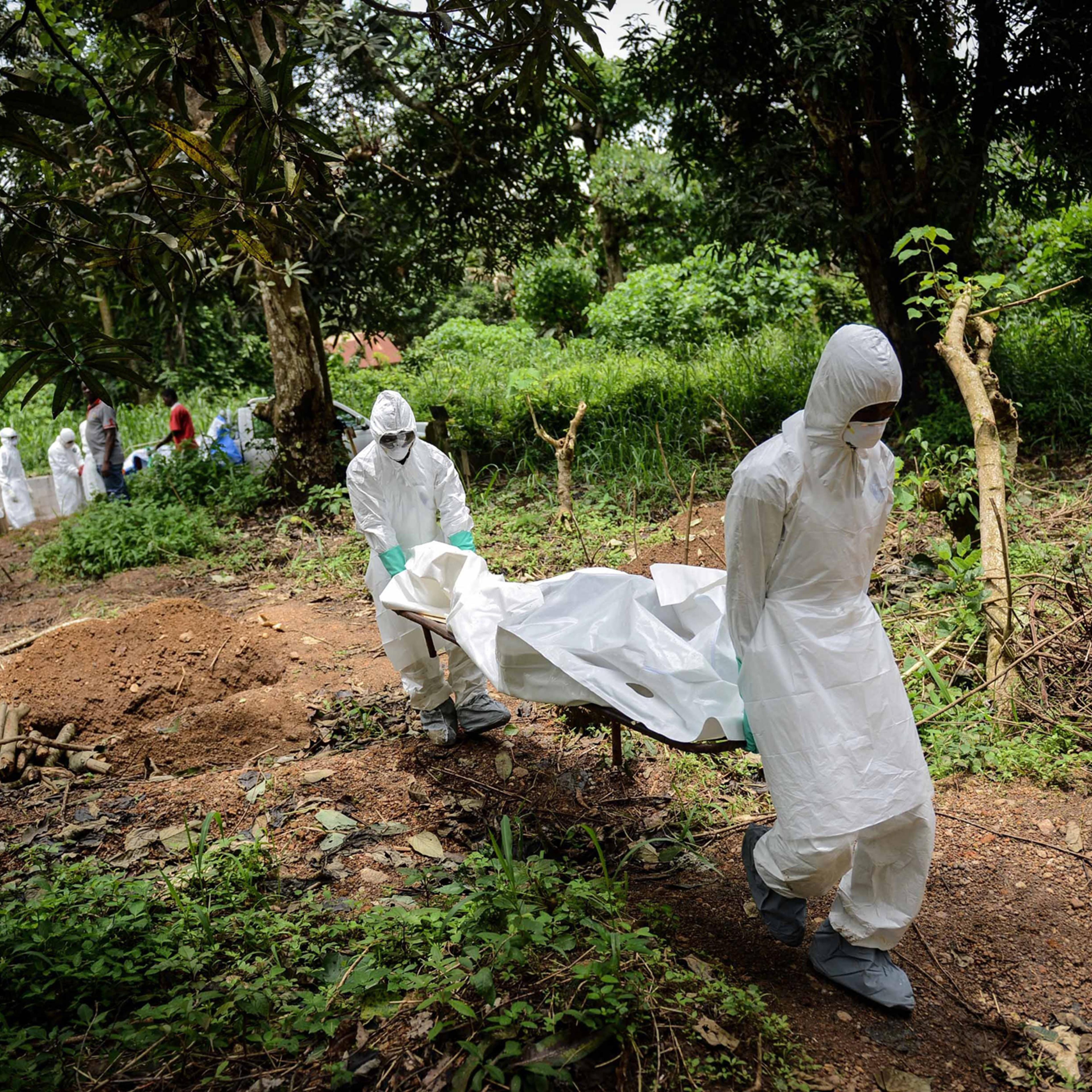 A group of young volunteers wear special uniforms for the burial of Ebola victims in Kenema, Sierra Leone on Aug. 24, 2014.