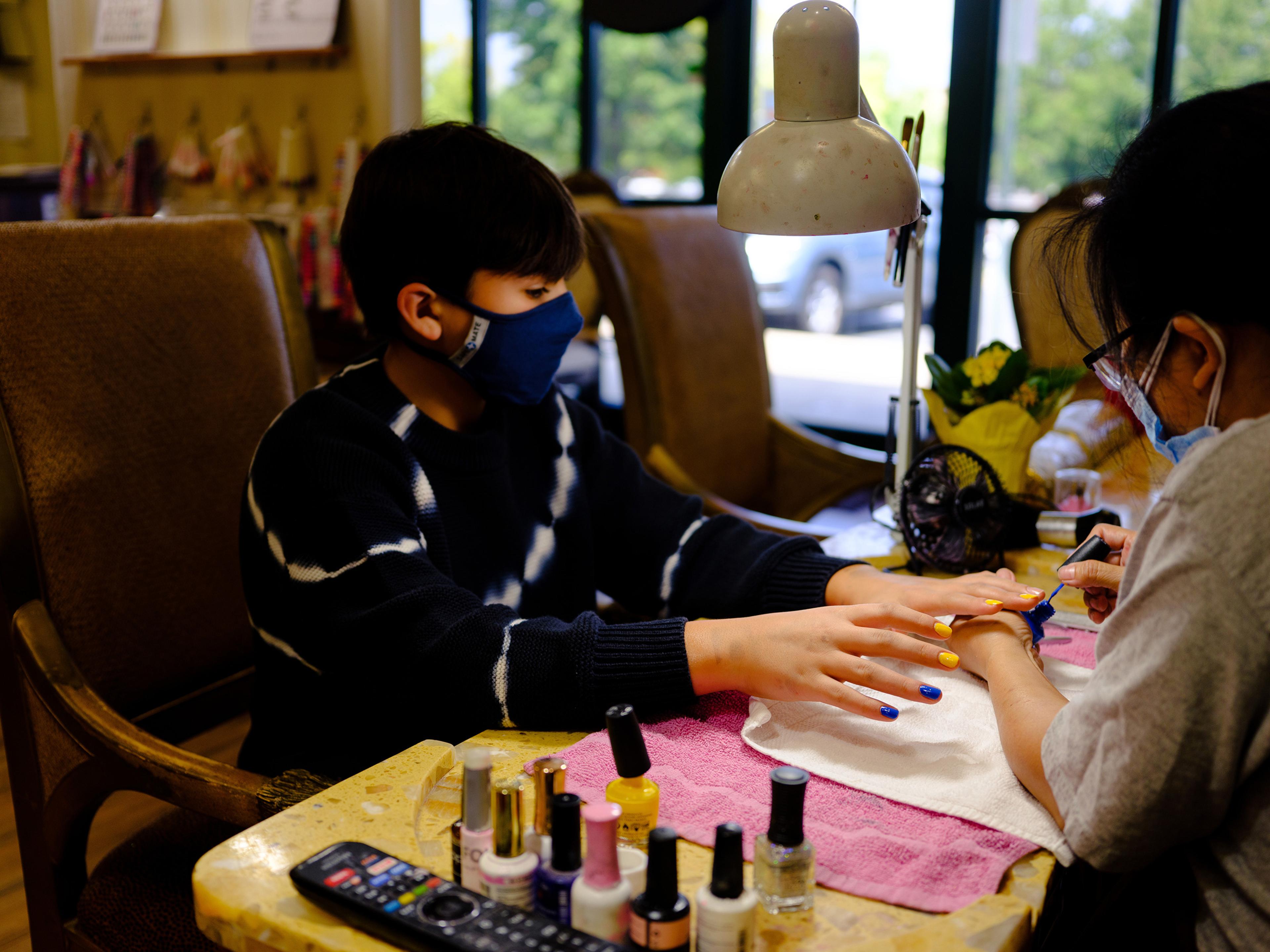 Eli, 12, gets their nails done in Mooresville, N.C.