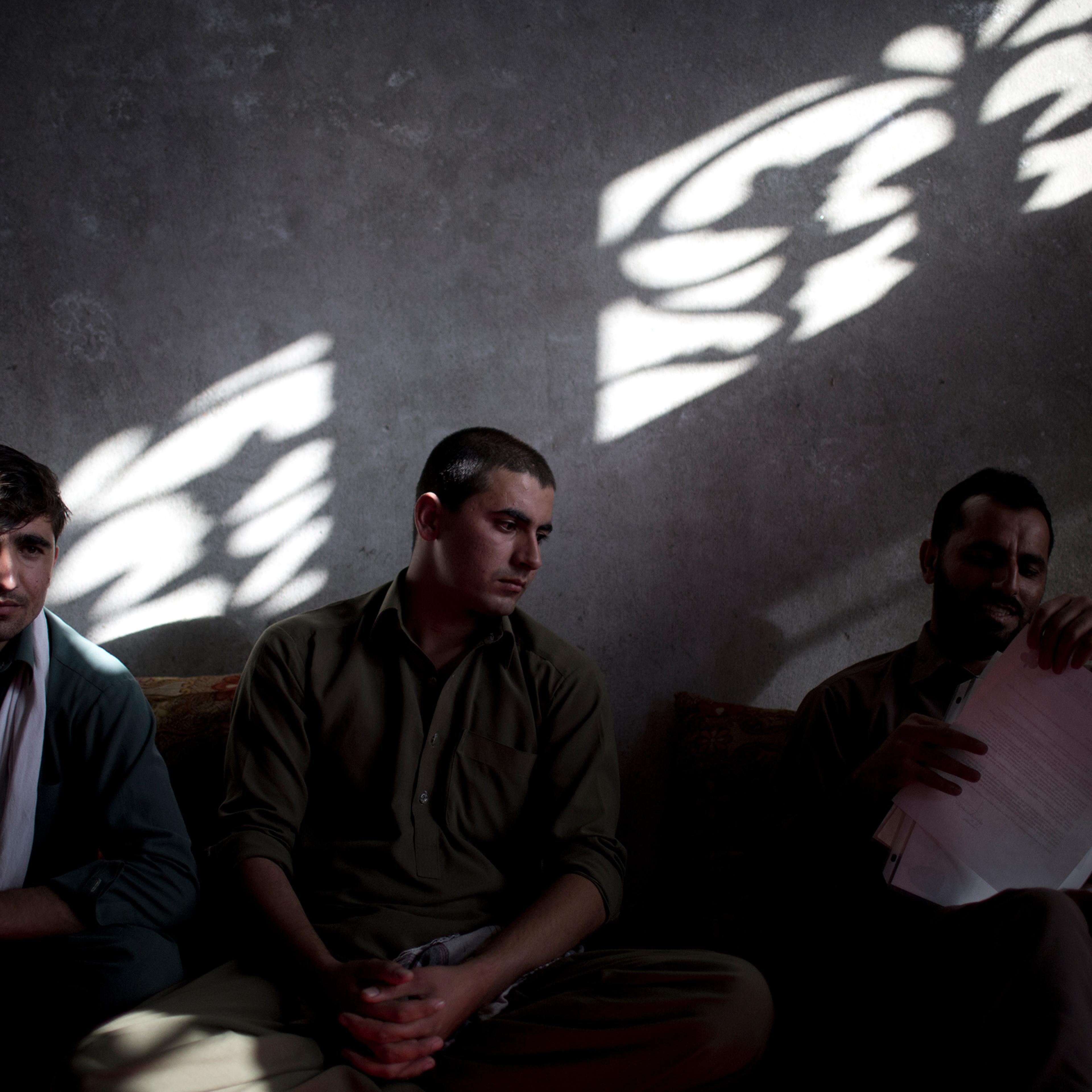 Interpreters, from left, Afiqullah, Irshadullah and Said Hussein, all working for the U.S. army, meet in Jalalabad, Afghanistan, on Oct. 20, 2012. They applied for a U.S. visa through the Afghan SIV program.