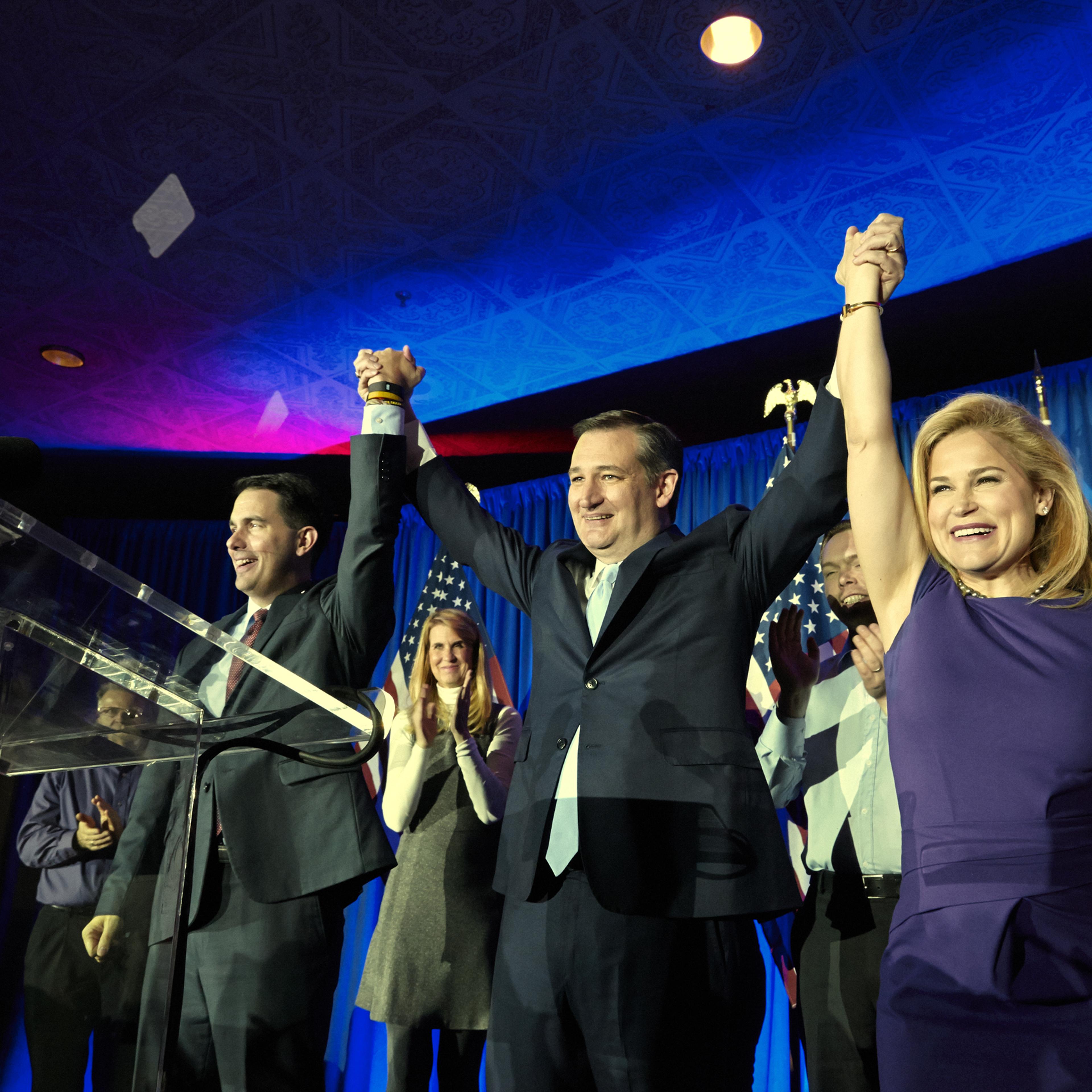 Senator Ted Cruz celebrates winning the Wisconsin primary with his wife Heidi and Governor Scott Walker in Milwaukee on April 5