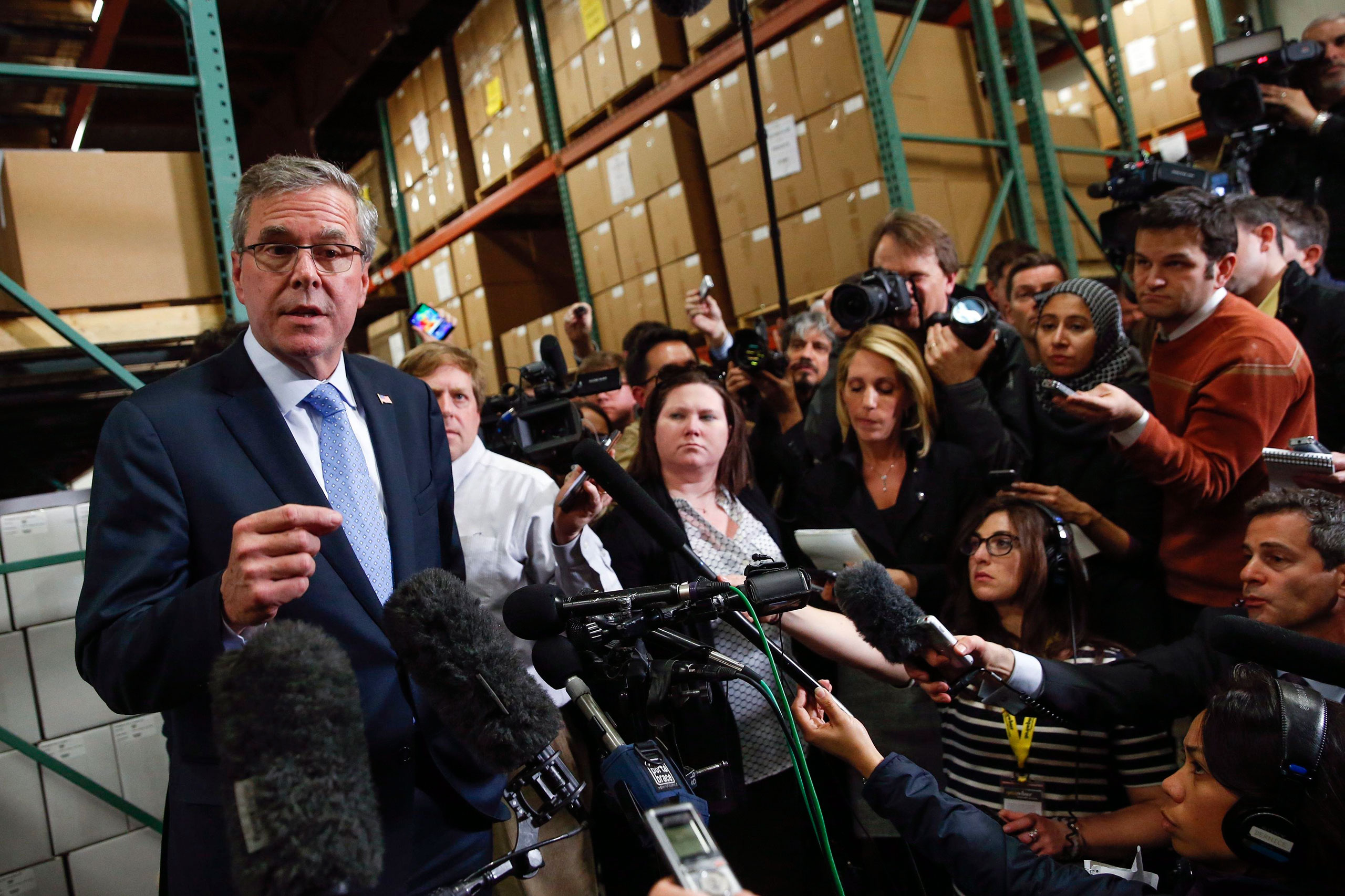 Former Florida Governor Jeb Bush speaks to the media after visiting Integra Biosciences during a campaign stop in Hudson, New Hampshire