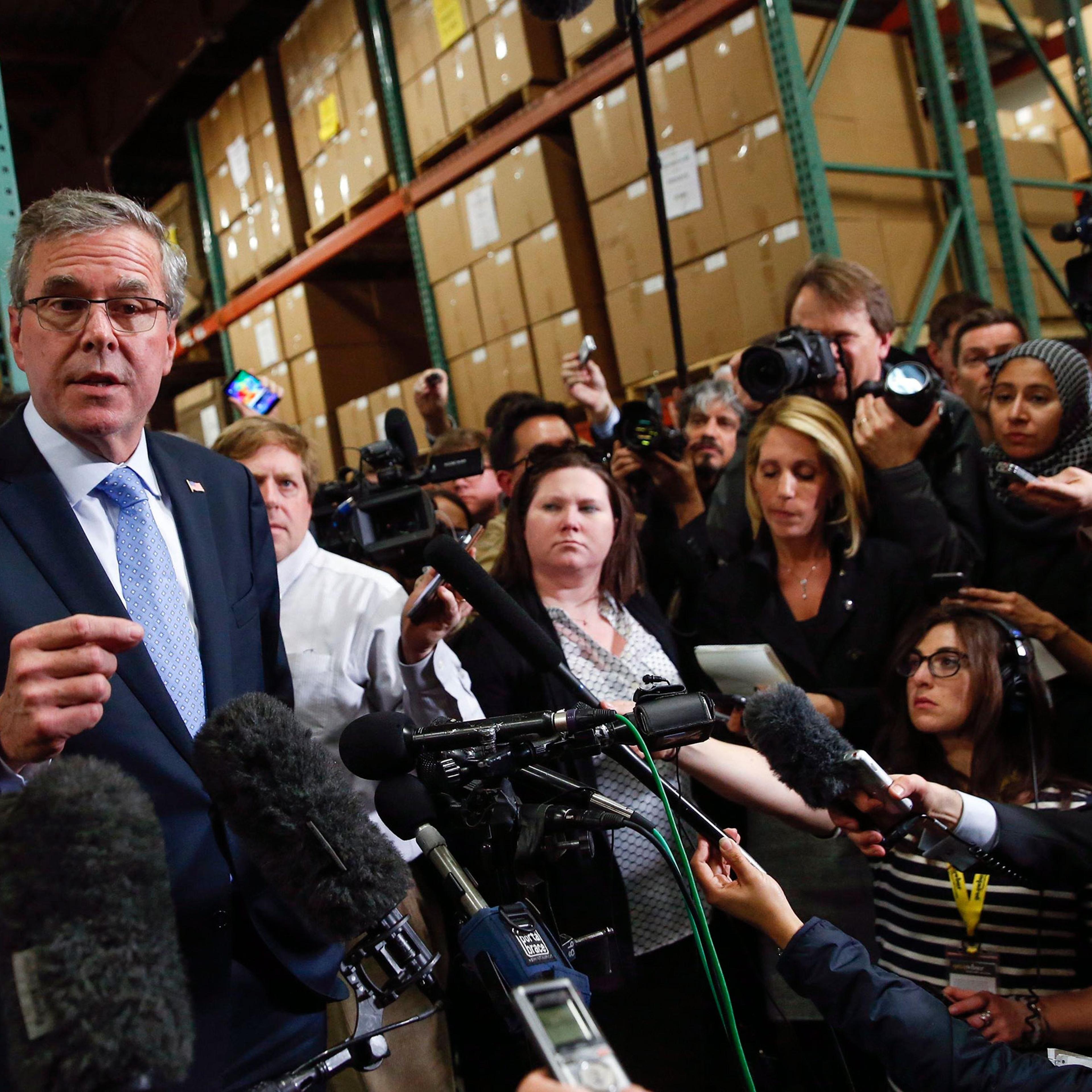 Former Florida Governor Jeb Bush speaks to the media after visiting Integra Biosciences during a campaign stop in Hudson, New Hampshire