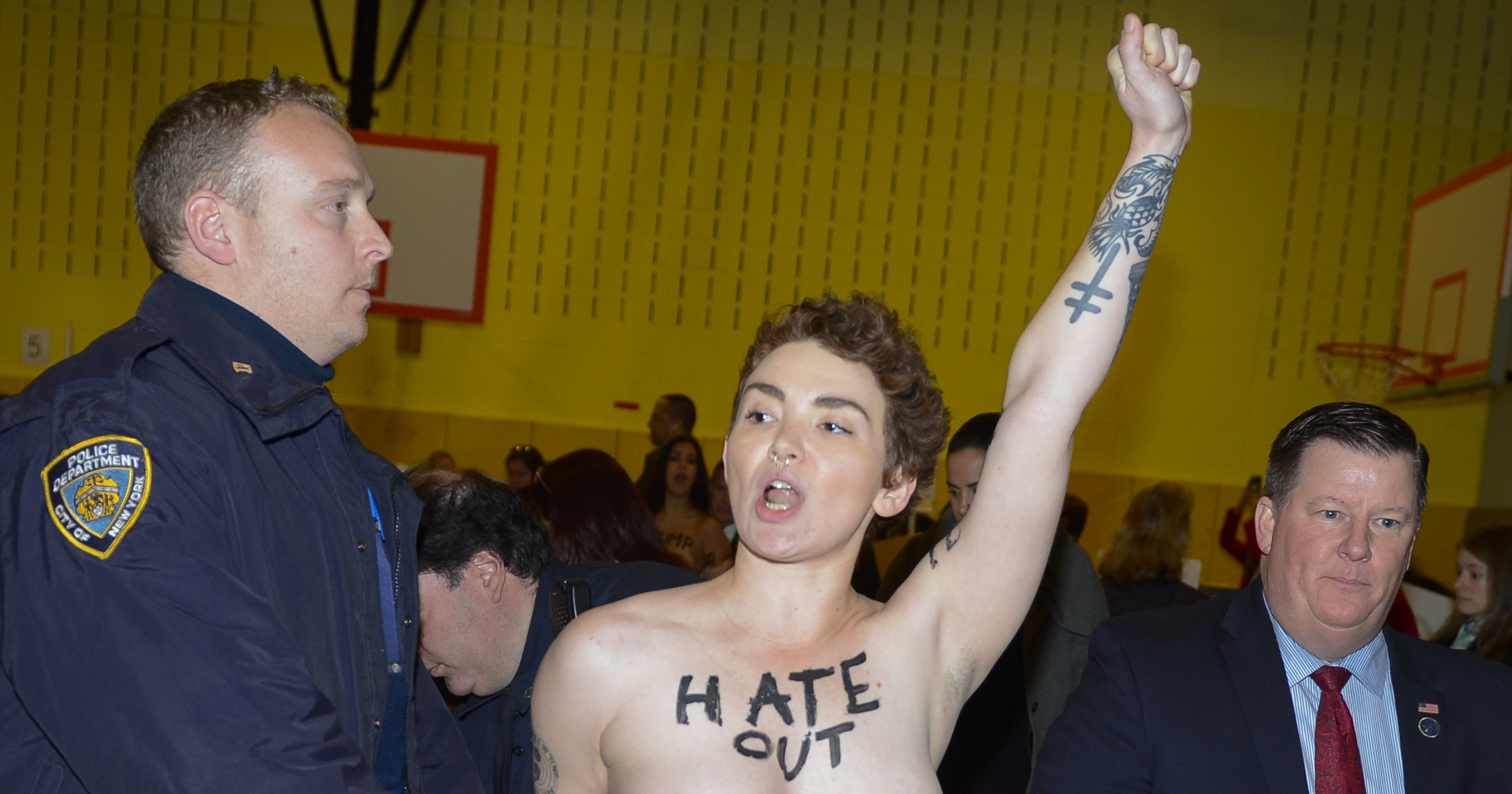 One of the two topless protestors at the site where Republican presidential candidate Donald Trump voted at P.S. 59 in New York City, on Nov. 8, 2016.