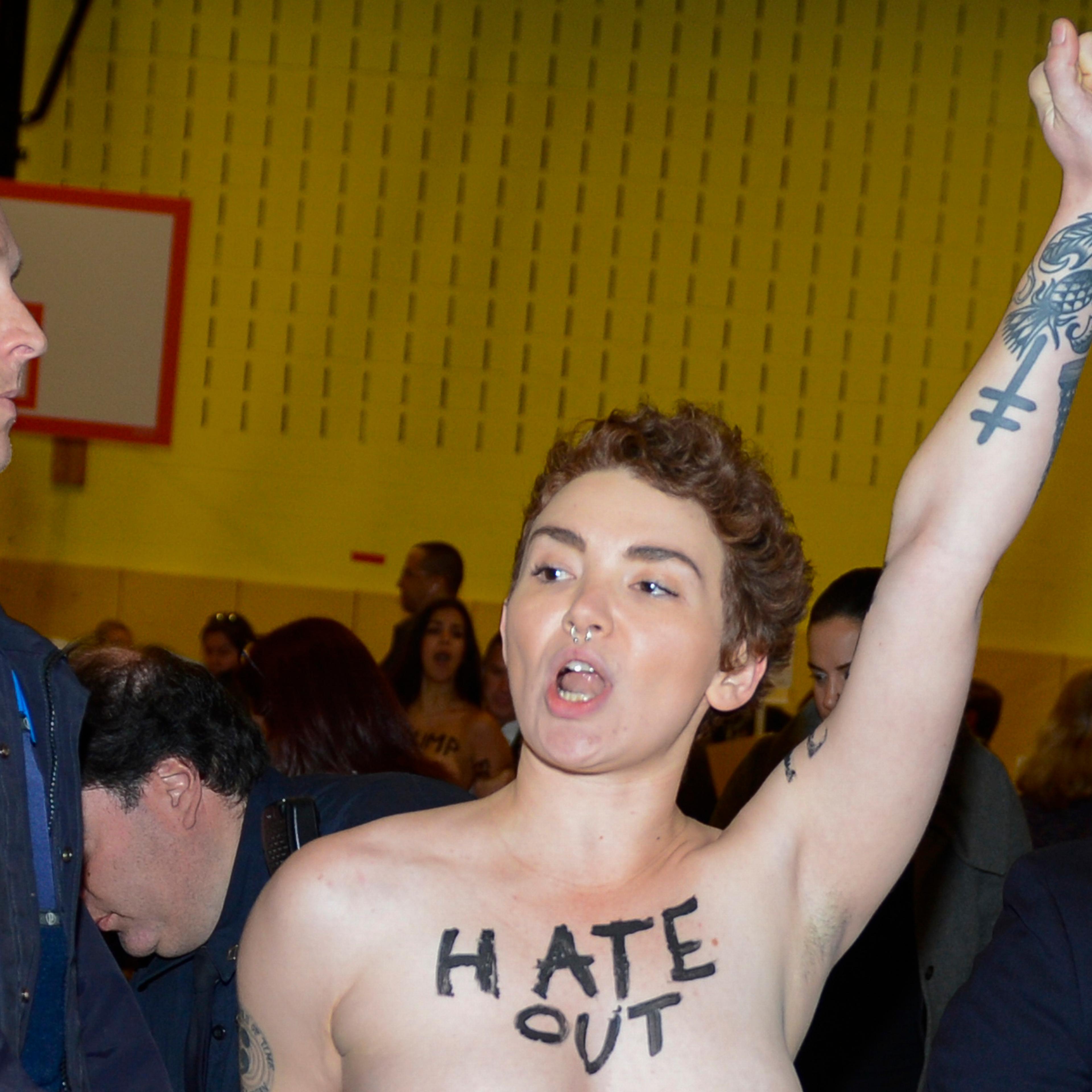 One of the two topless protestors at the site where Republican presidential candidate Donald Trump voted at P.S. 59 in New York City, on Nov. 8, 2016.