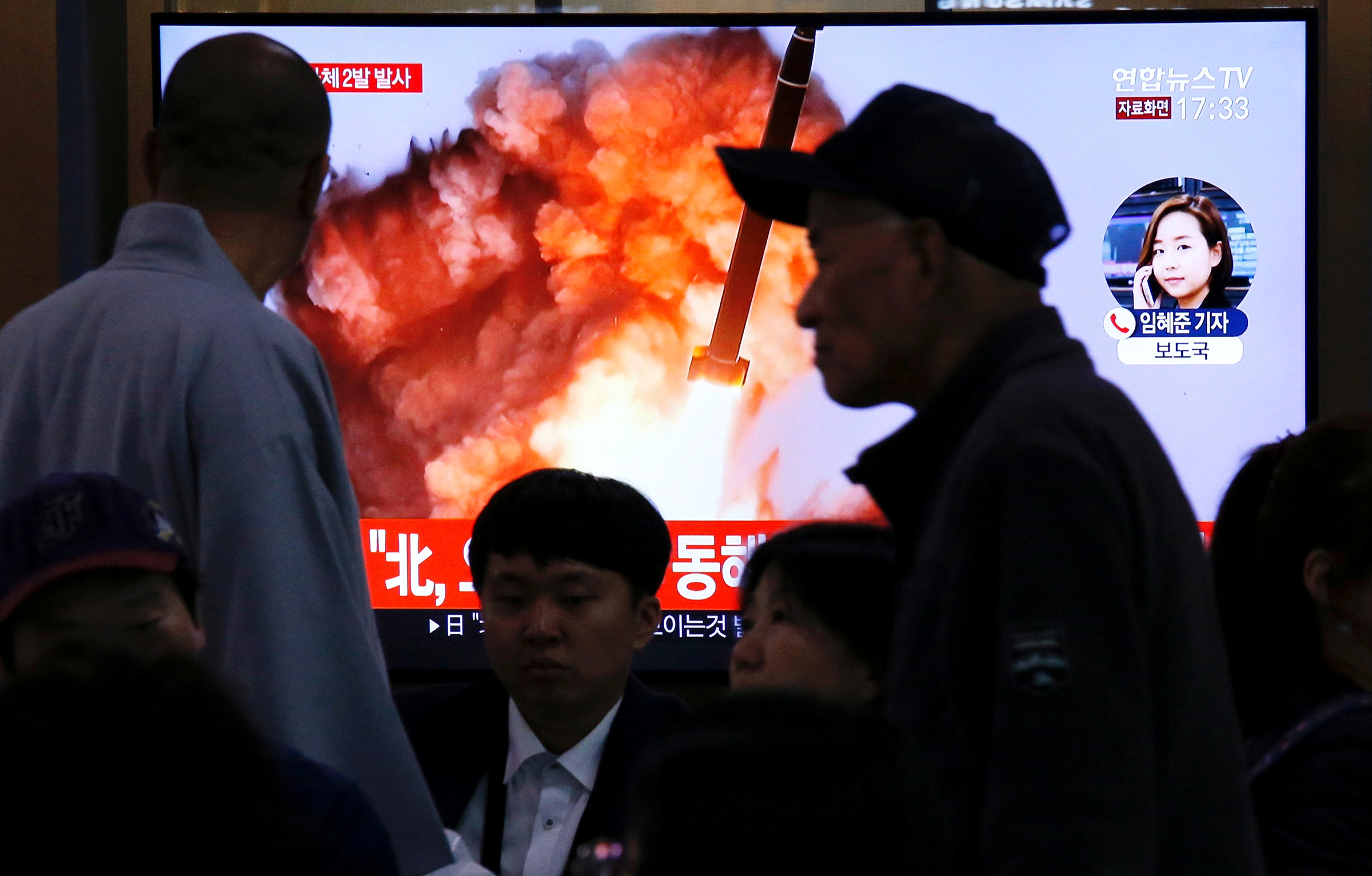 People watch a TV broadcast showing a file footage for a news report on North Korea firing two projectiles—possibly missiles—into the sea between the Korean peninsula and Japan, in Seoul on Oct. 31, 2019