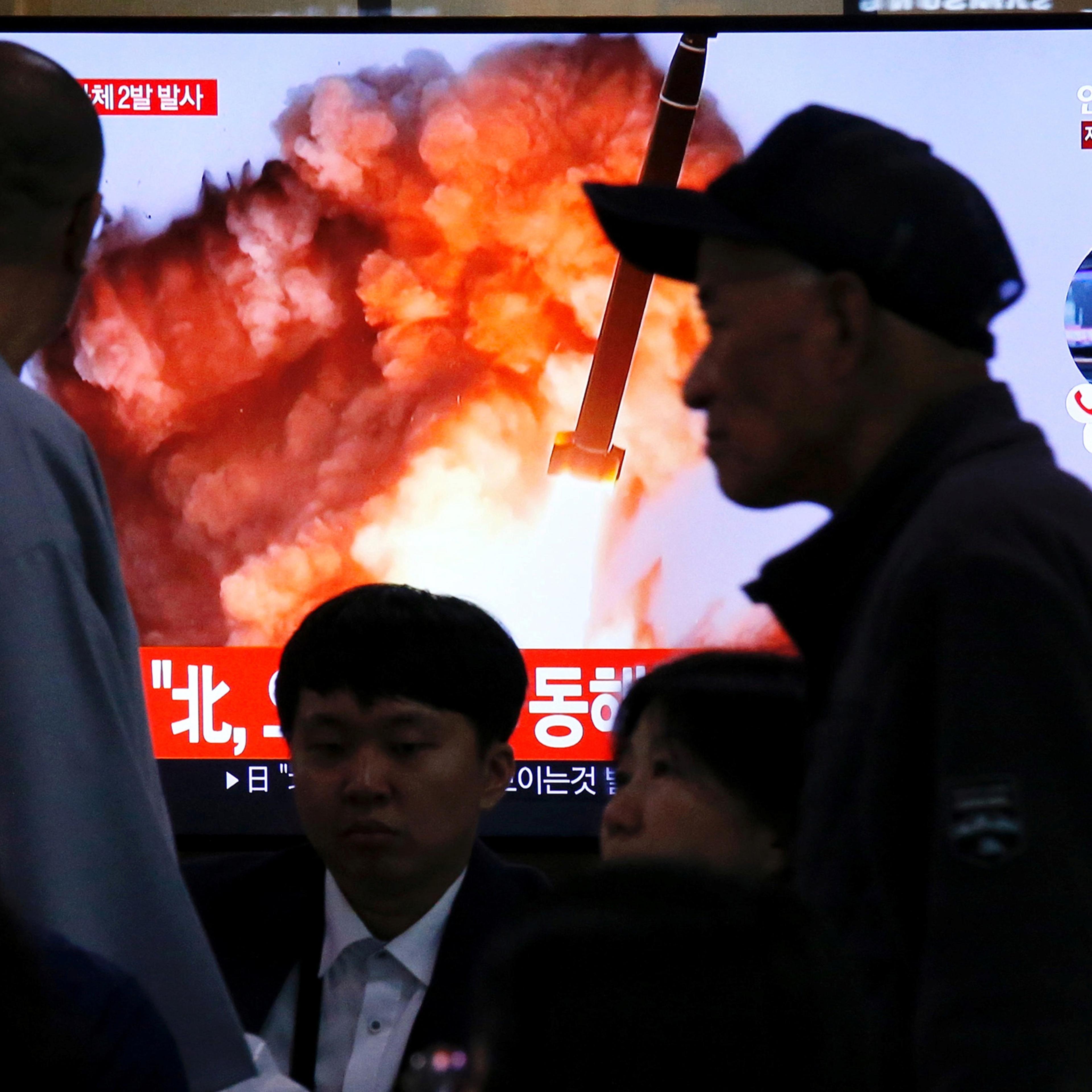 People watch a TV broadcast showing a file footage for a news report on North Korea firing two projectiles—possibly missiles—into the sea between the Korean peninsula and Japan, in Seoul on Oct. 31, 2019