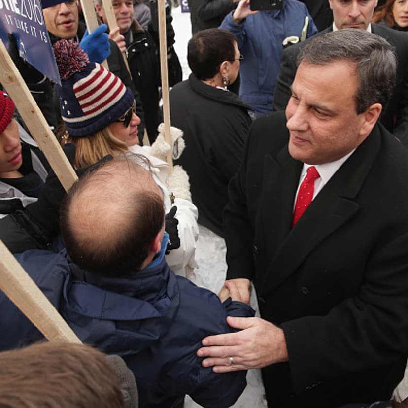 Republican presidential candidate New Jersey Governor Chris Christie (R) greets supporters outside the polling place at Webster School February 9, 2016 in Manchester, New Hampshire.