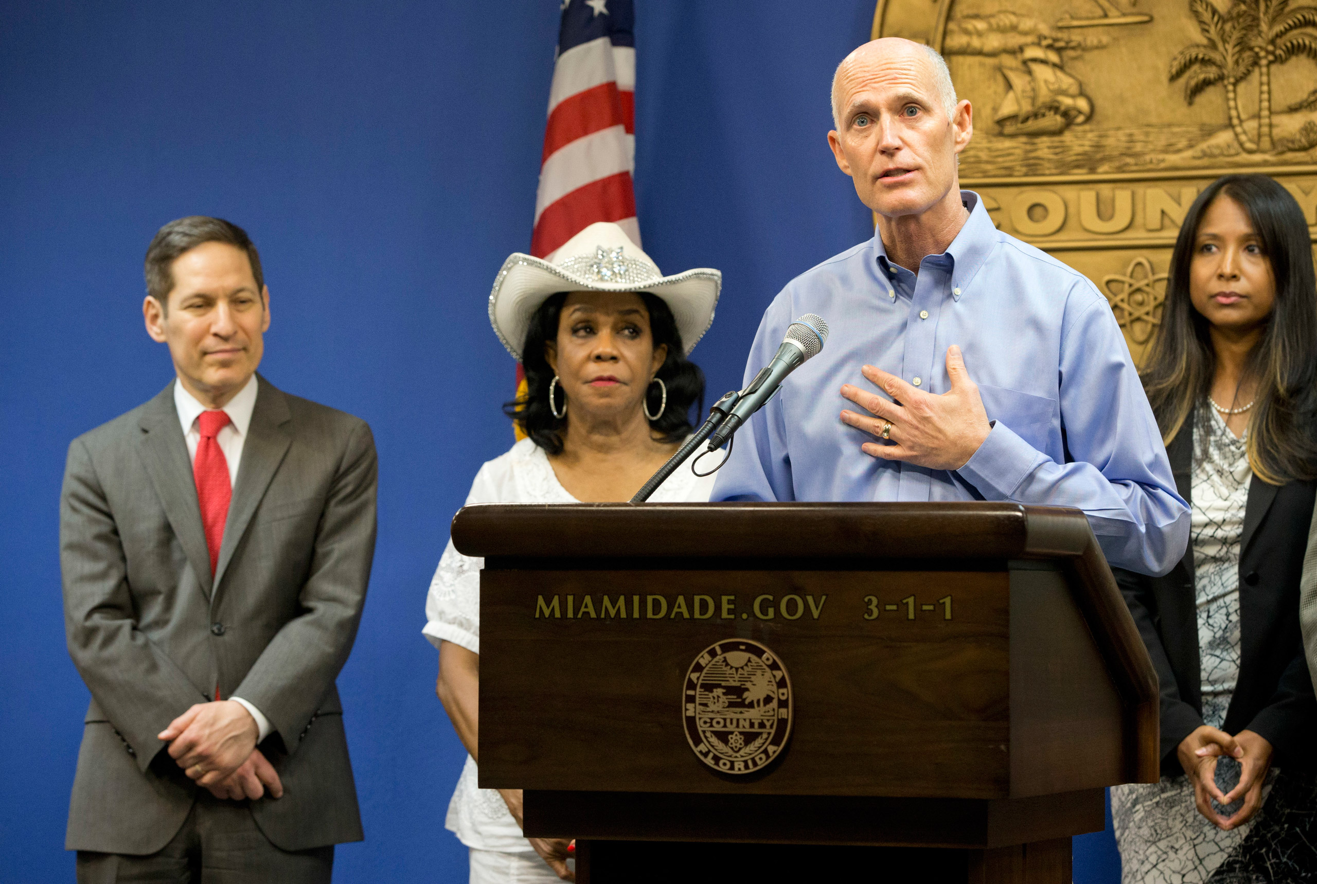 Florida Gov. Rick Scott, foreground, speaks during a news conference along with Centers for Disease Control and Prevention Director Dr. Tom Frieden, left, Rep. Frederica Wilson, D-FL, and Fla. Surgeon General and Secretary, Dr. Celeste Philip, far right,