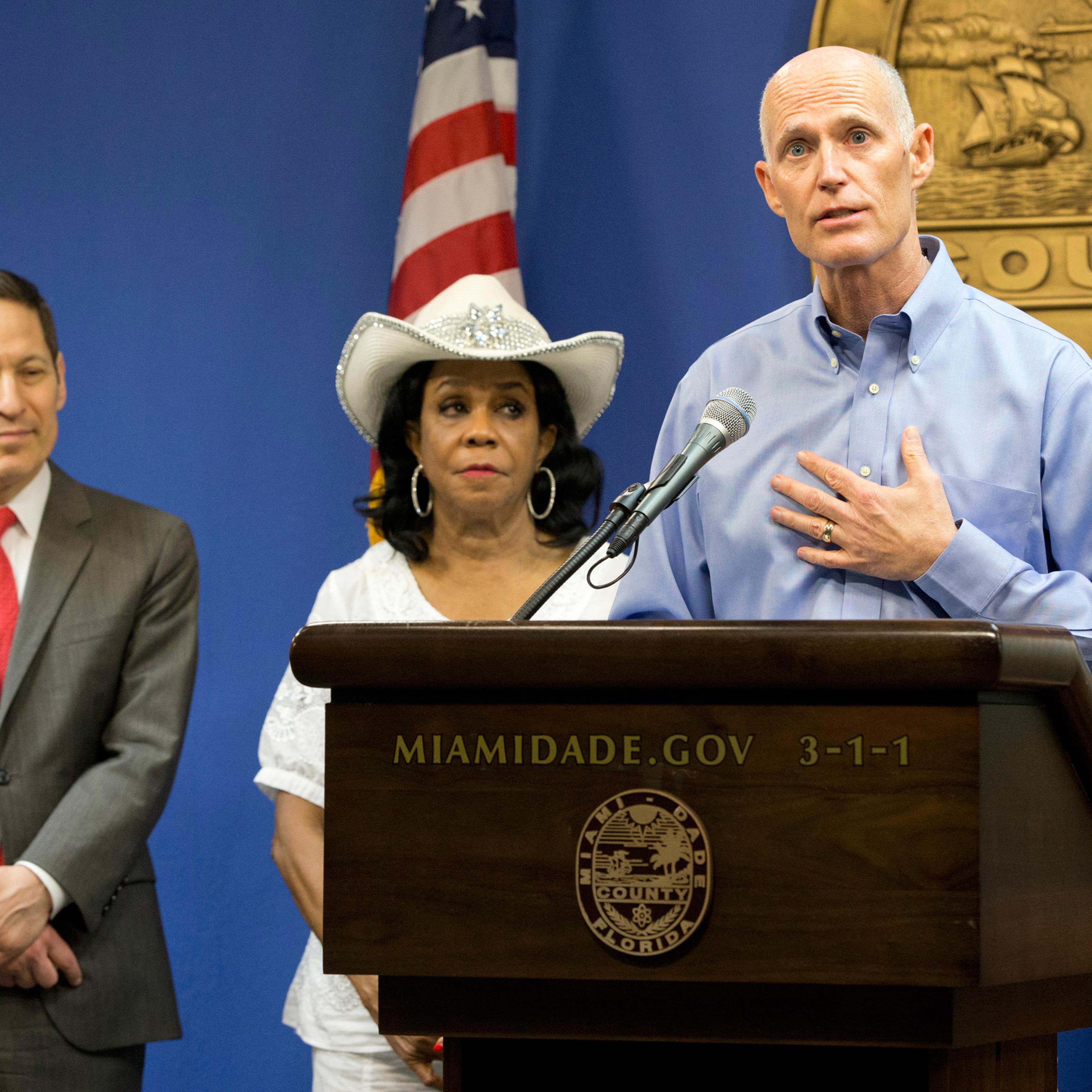 Florida Gov. Rick Scott, foreground, speaks during a news conference along with Centers for Disease Control and Prevention Director Dr. Tom Frieden, left, Rep. Frederica Wilson, D-FL, and Fla. Surgeon General and Secretary, Dr. Celeste Philip, far right,