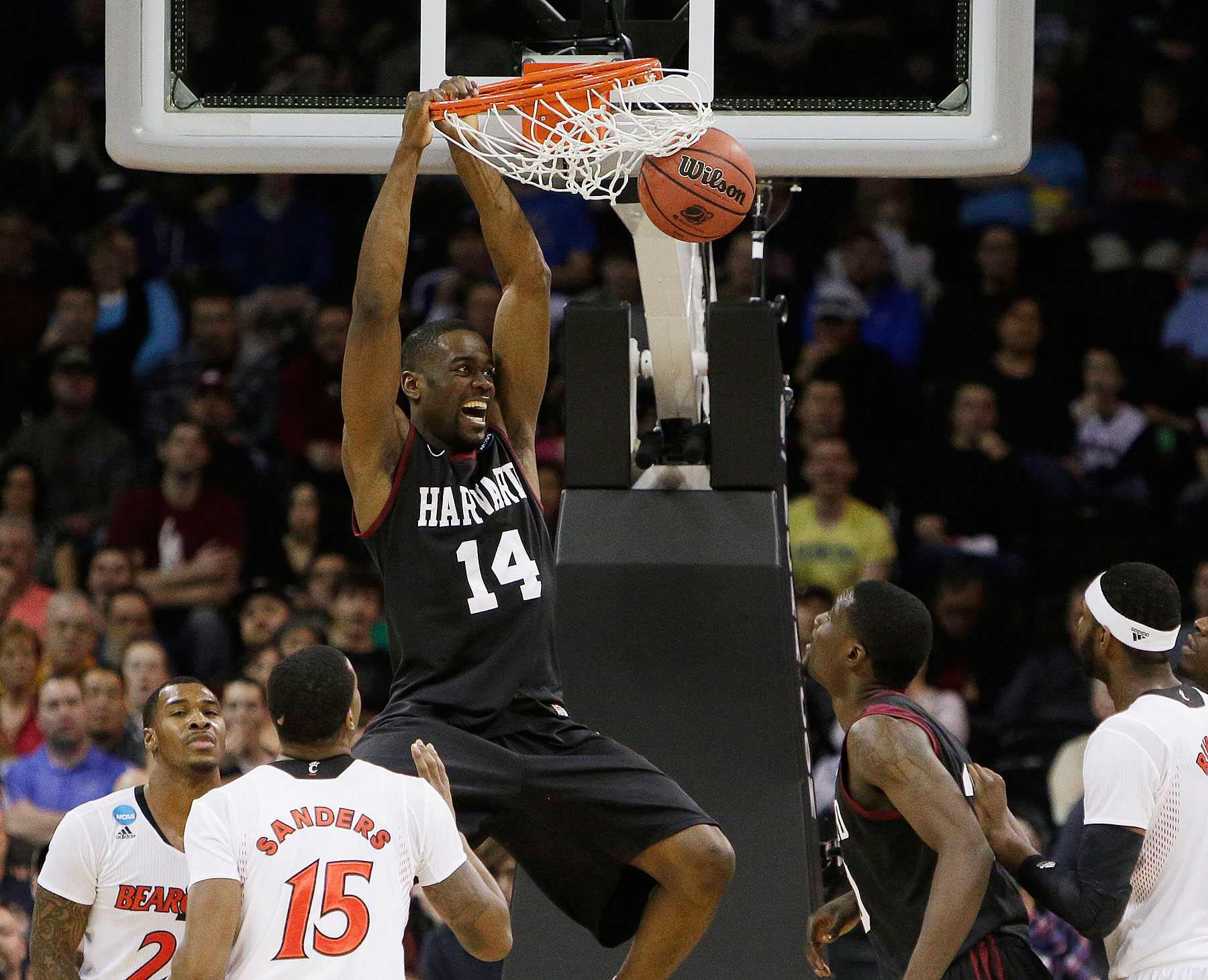 Harvardís Steve Moundou-Missi dunks against Cincinnati in the second half during the second-round of the NCAA men's college basketball tournament in Spokane, Wash., March 20, 2014.