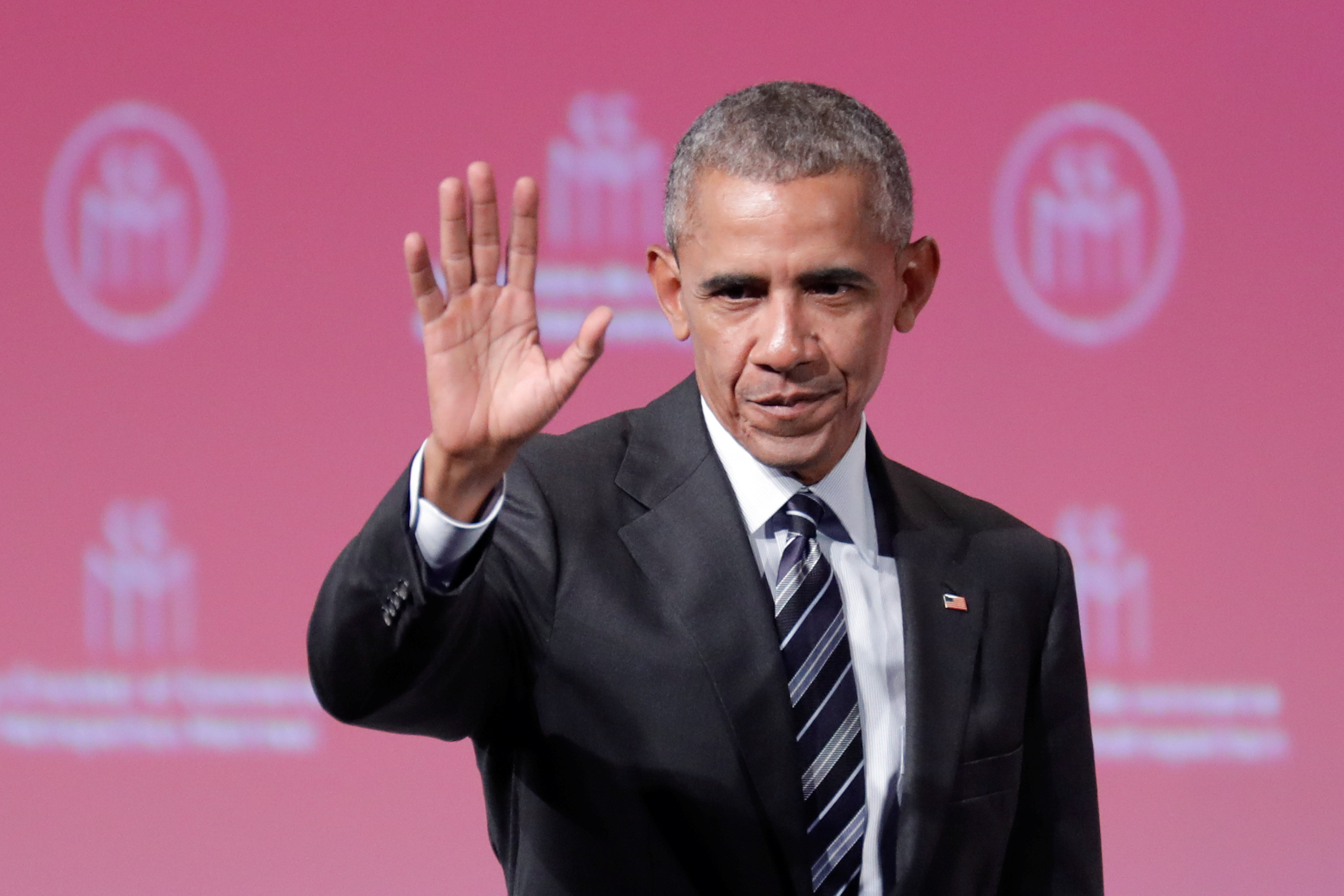Former U.S. President Barack Obama waves after his keynote speech to the Montreal Chamber of Commerce in Montreal