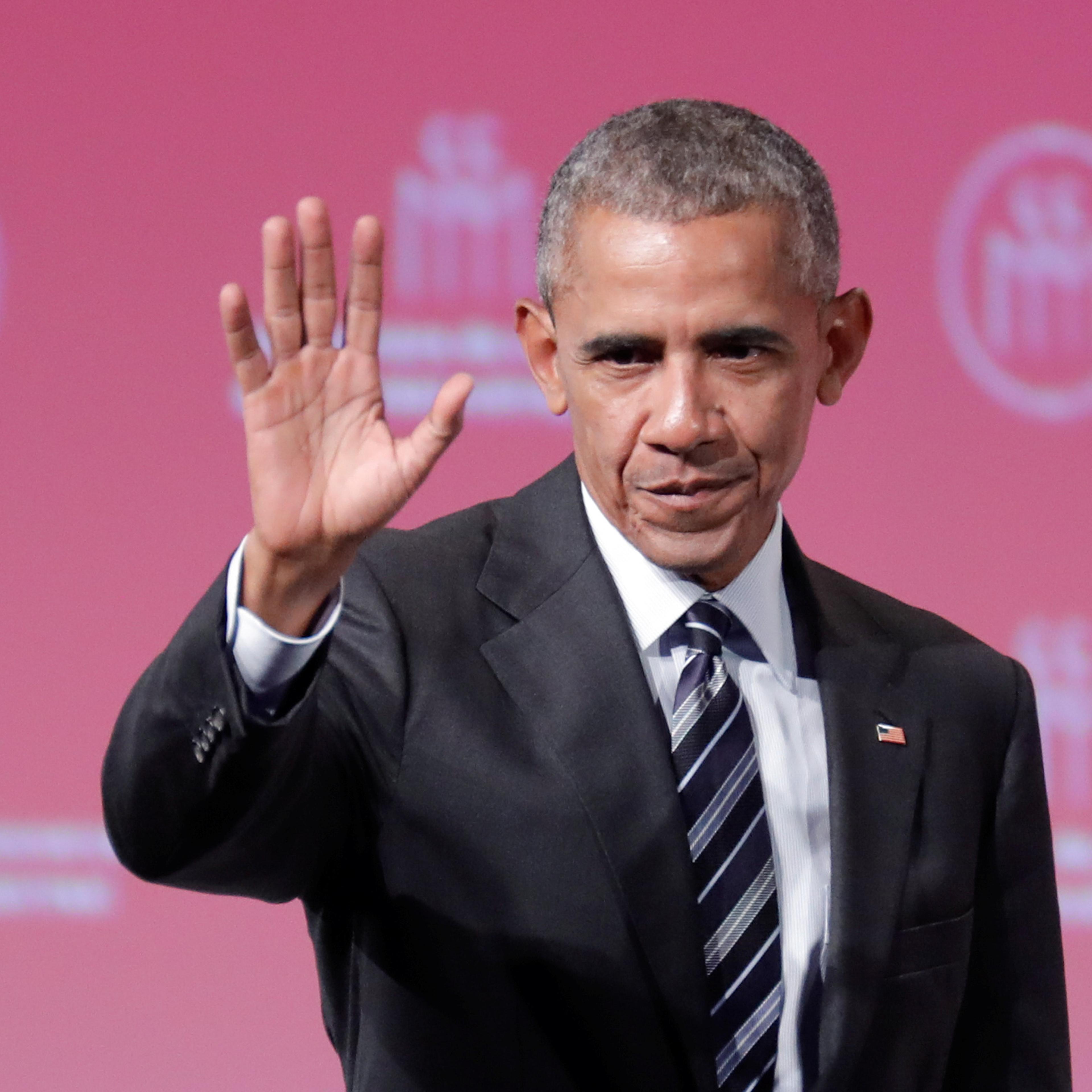Former U.S. President Barack Obama waves after his keynote speech to the Montreal Chamber of Commerce in Montreal