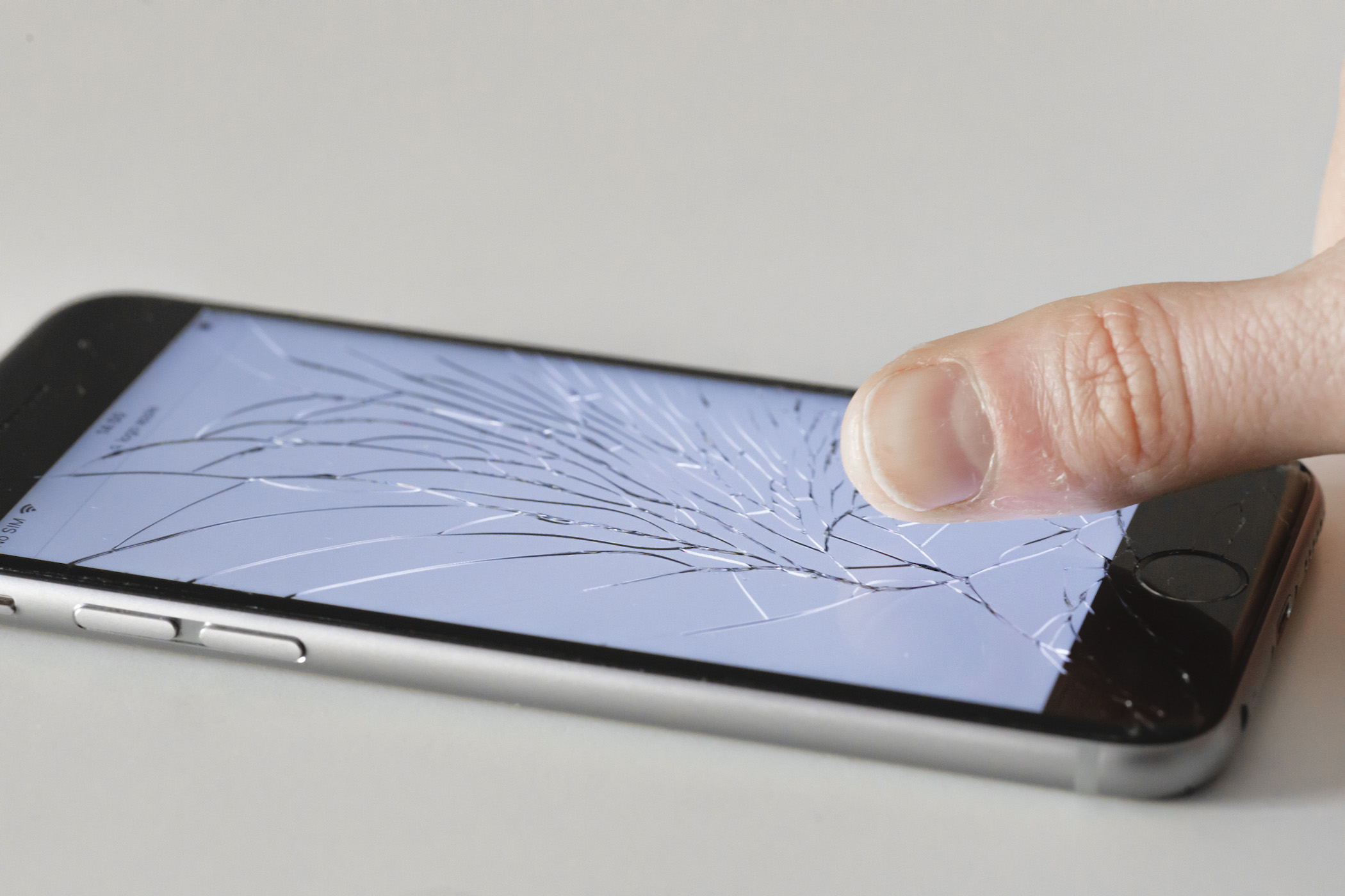 Berlin, Germany - March 05: Apple Iphone with shattered glass on March 05, 2018 in Berlin, Germany.