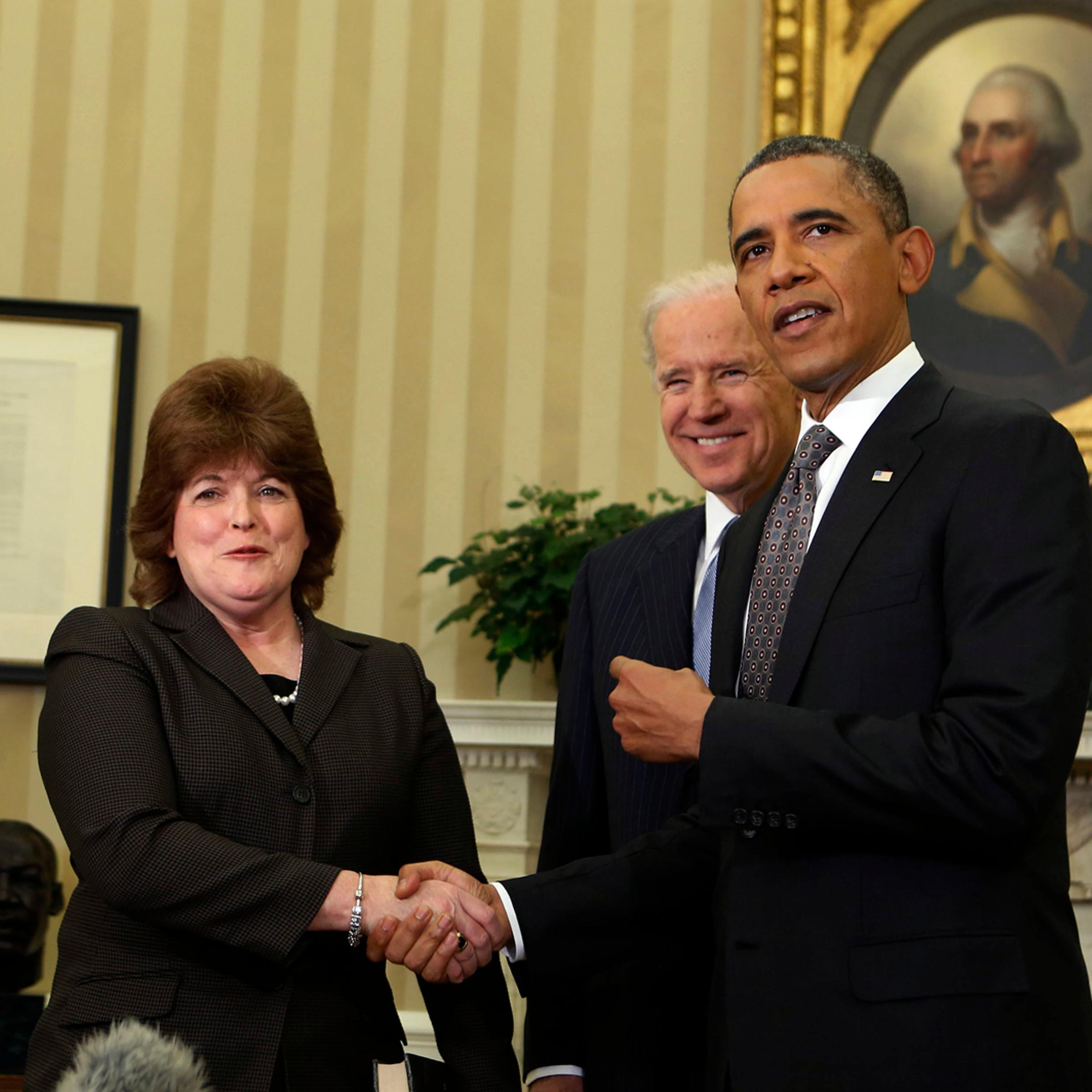 U.S. President Obama shakes hands with U.S. Secret Service agent Pierson after she is sworn in as first woman Director of the Secret Service in the Oval Office of the White House in Washington