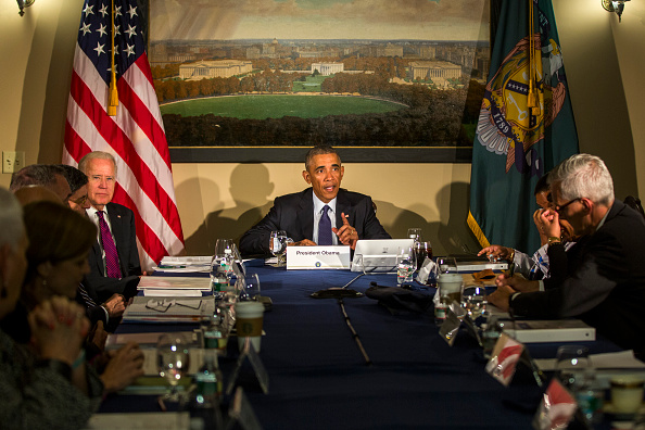 President Barack Obama, along with Vice President Joe Biden, meets with his National Security Council, including FBI Director James Comey, Homeland Security Secretary Jeh Johnson and National Counterterrorism Center Director Nick Rasmussen, at the Treasu
