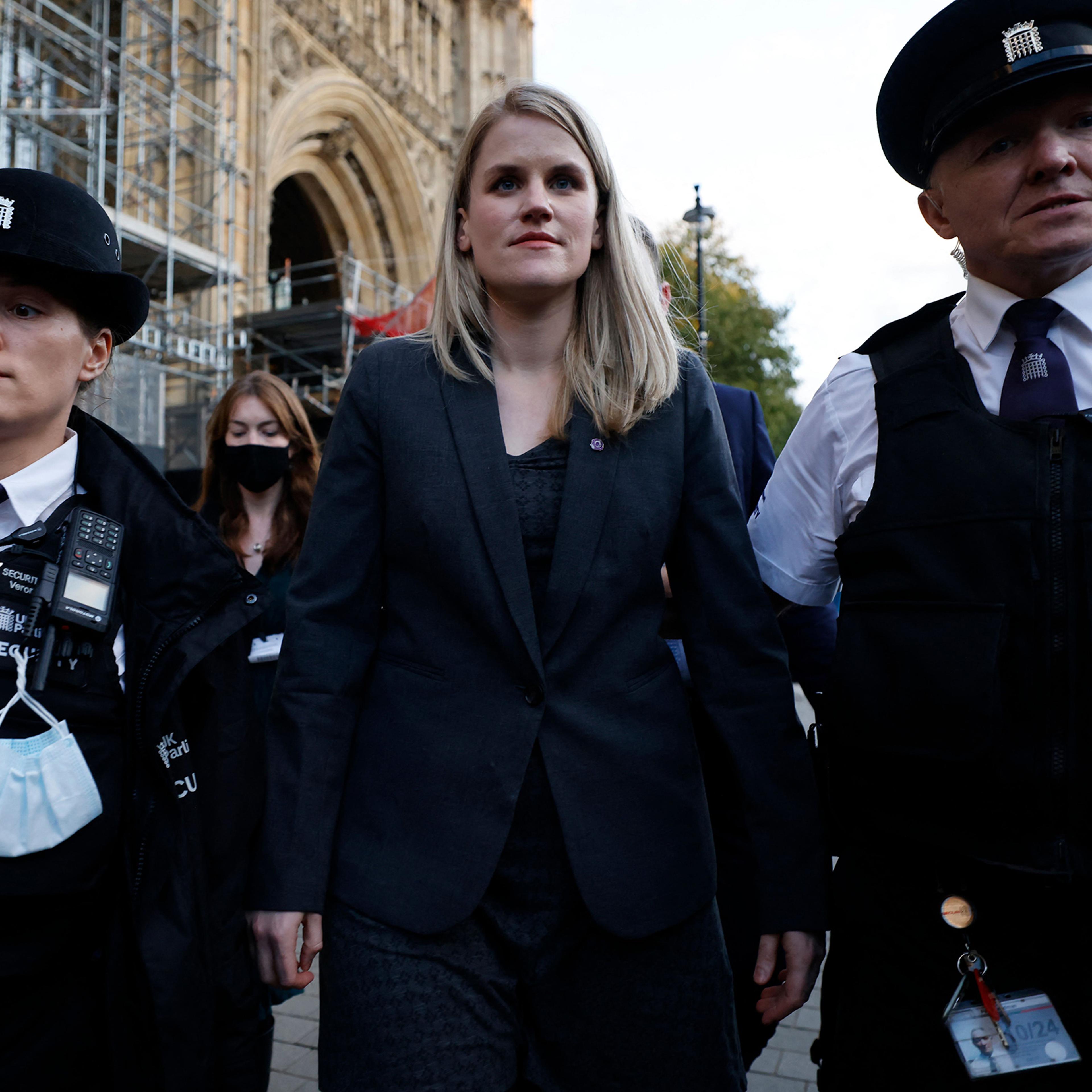 Facebook whistleblower Frances Haugen (center) leaves the Houses of Parliament