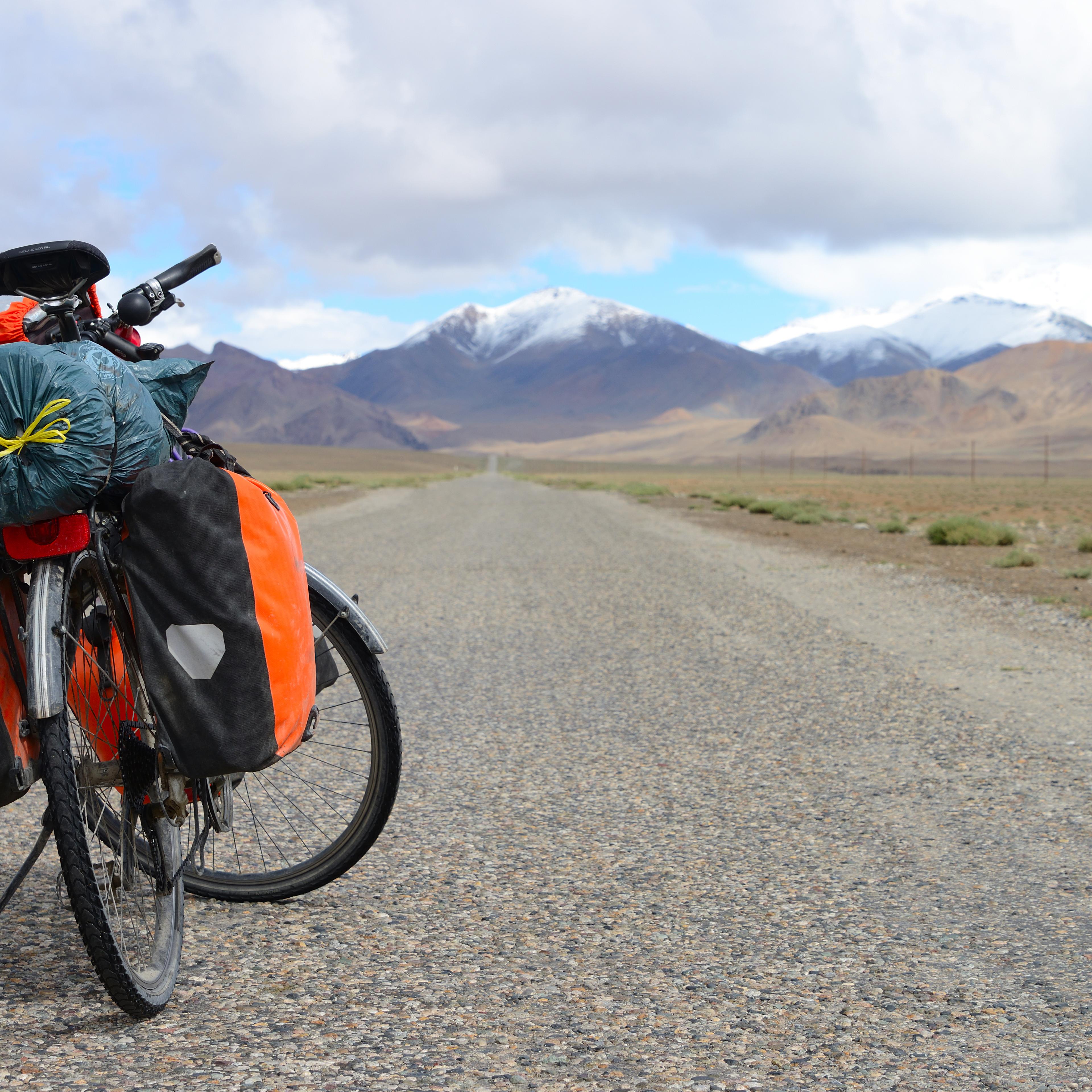 Long distance cycling on M41 Pamir Highway, Pamir Mountain Range, Tajikistan