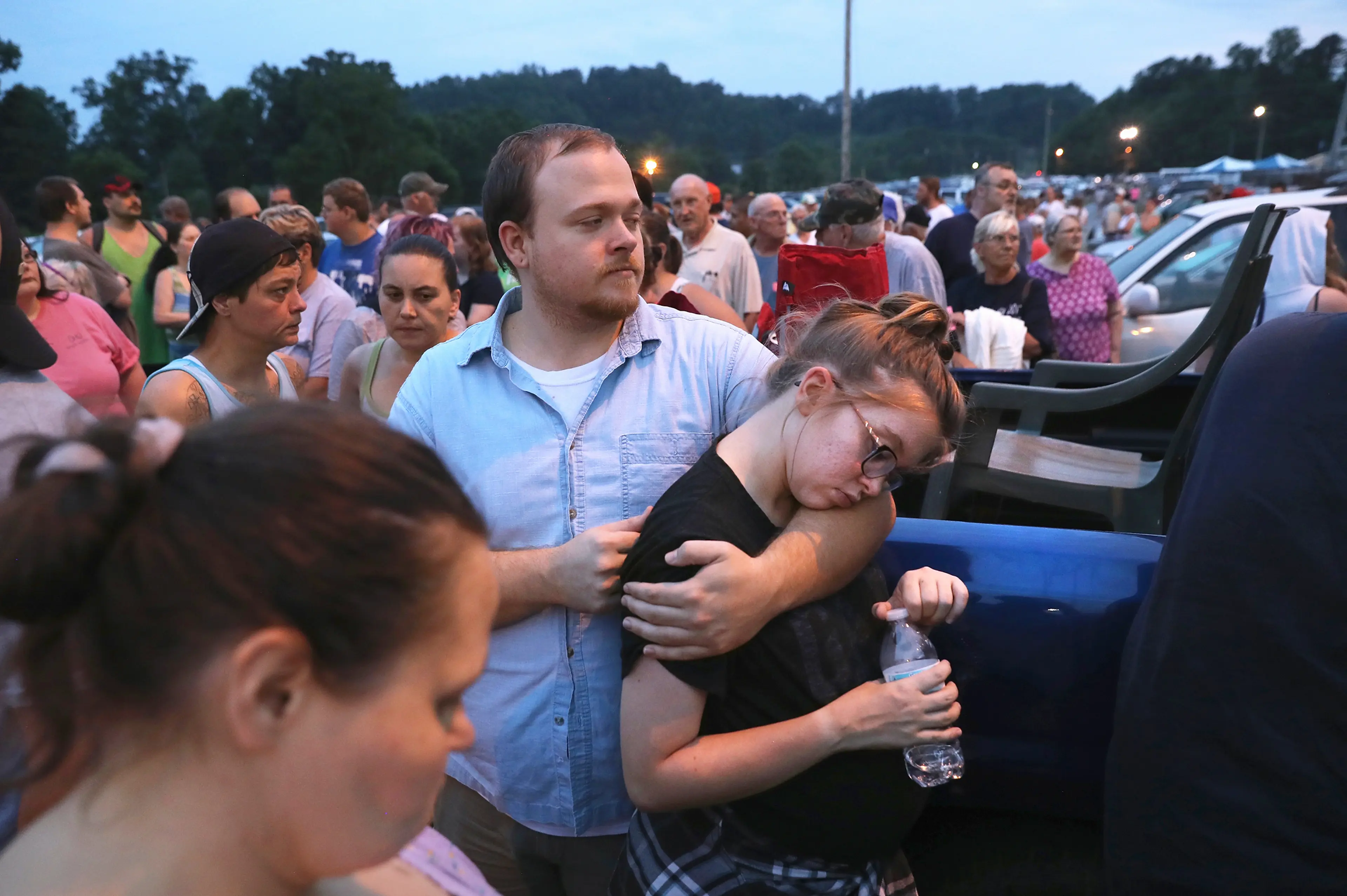 People wait to enter the Remote Area Medical (RAM) mobile clinic after sleeping in their cars on July 21, 2017 in Wise, Va.