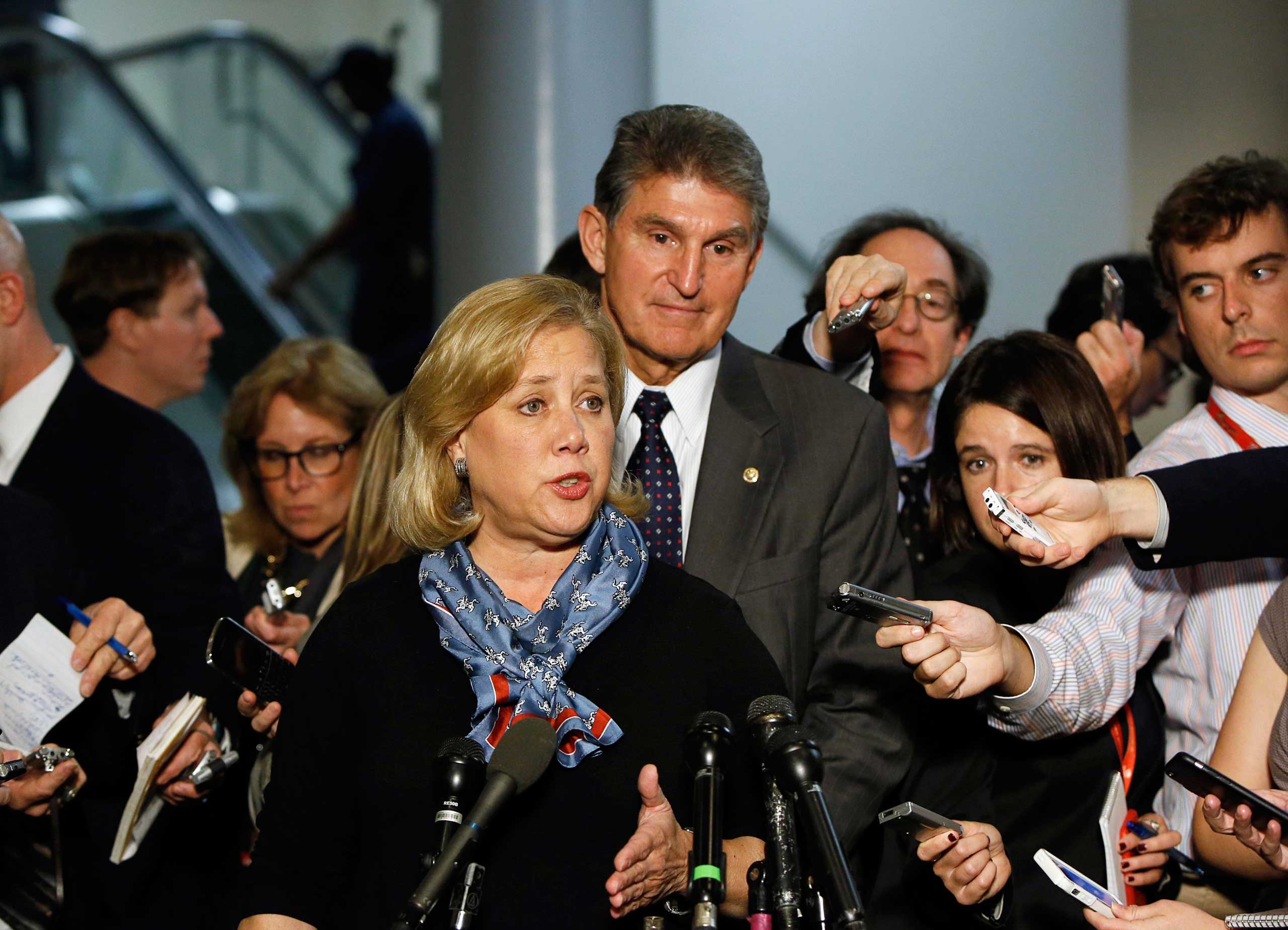 Senator Mary Landrieu (D-LA) holds a news conference with fellow committee member Senator Joe Manchin (D-WV) on the Keystone XL pipeline in Washington on Nov. 12, 2014.