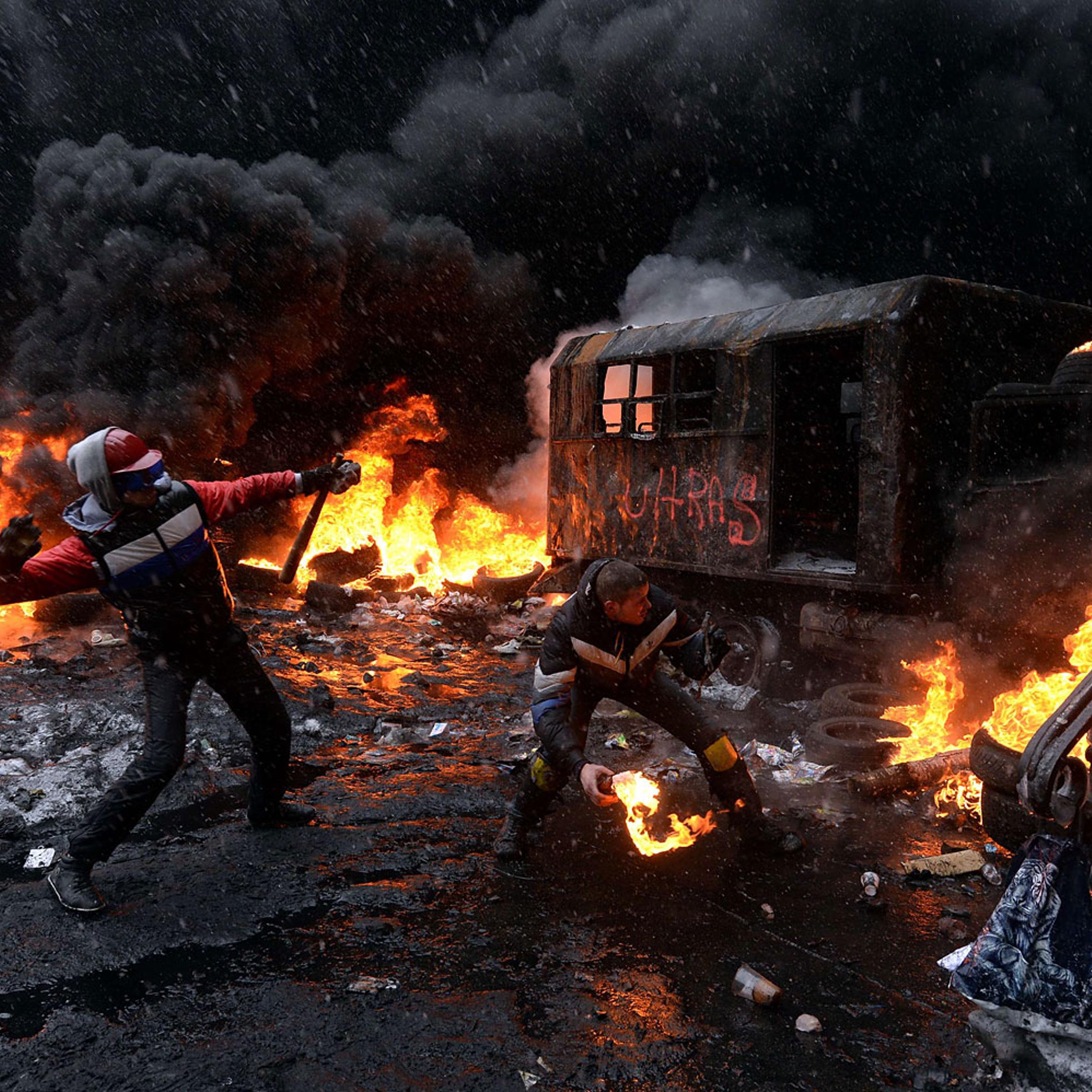 Tires burn in the street, set alight by protesters in clashes with police in central Kiev, Jan. 22, 2014.