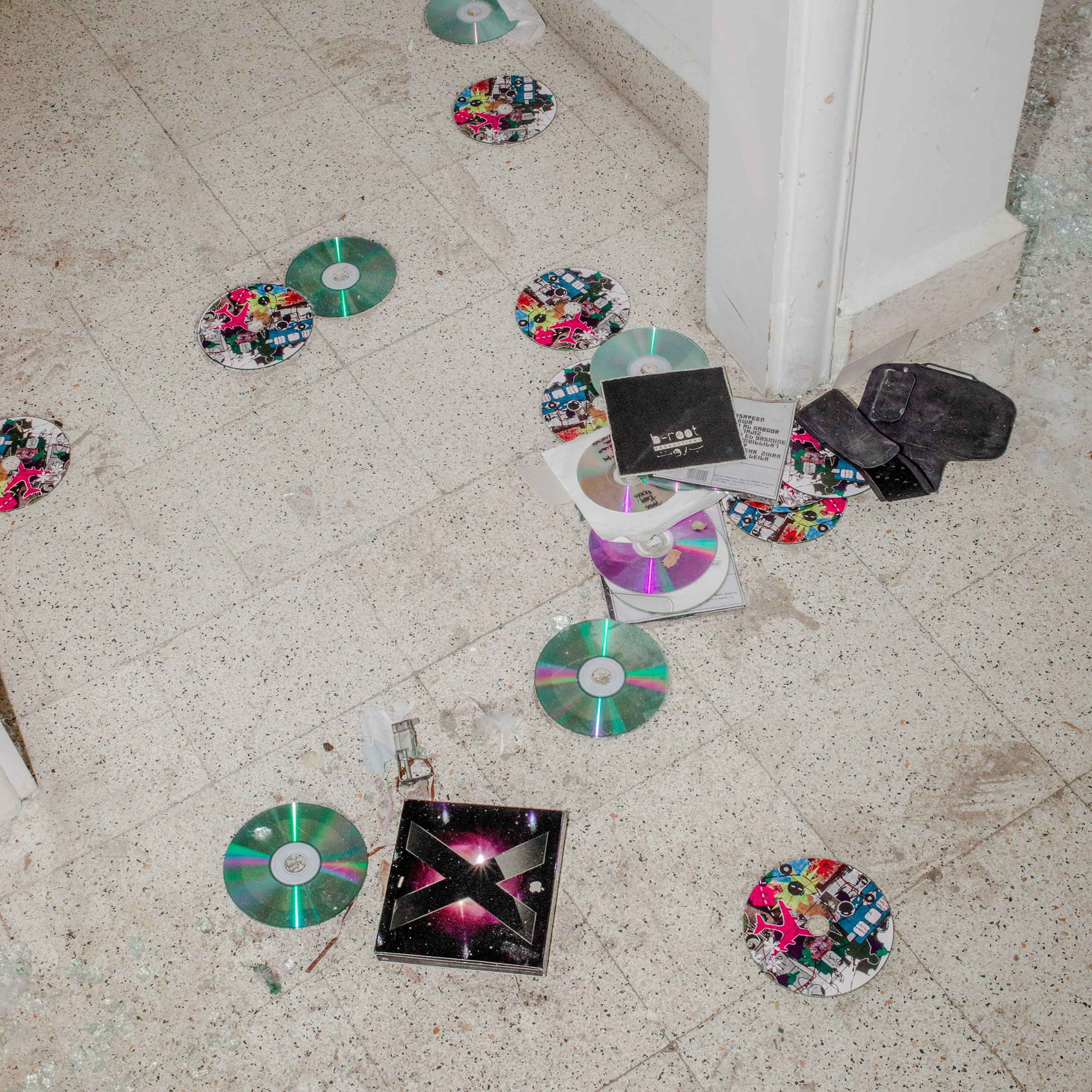 CDs are scattered on the floor of music producer Jana Saleh's apartment, which was heavily damaged by the port explosion and blast wave. "I Google-mapped the distance between the blast and my home. It’s approximately two kilometers (1.24 mi.). We managed