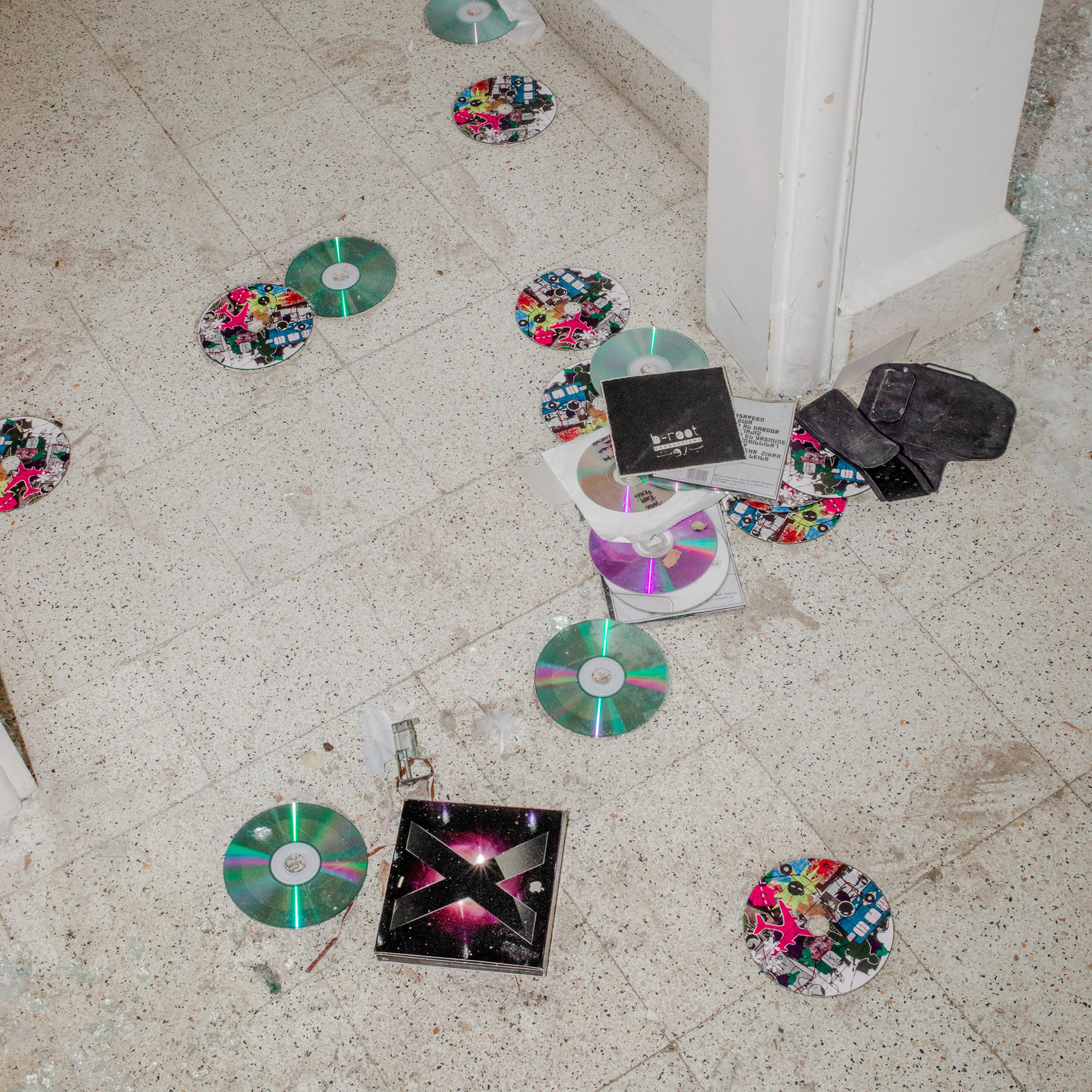 CDs are scattered on the floor of music producer Jana Saleh's apartment, which was heavily damaged by the port explosion and blast wave. "I Google-mapped the distance between the blast and my home. It’s approximately two kilometers (1.24 mi.). We managed