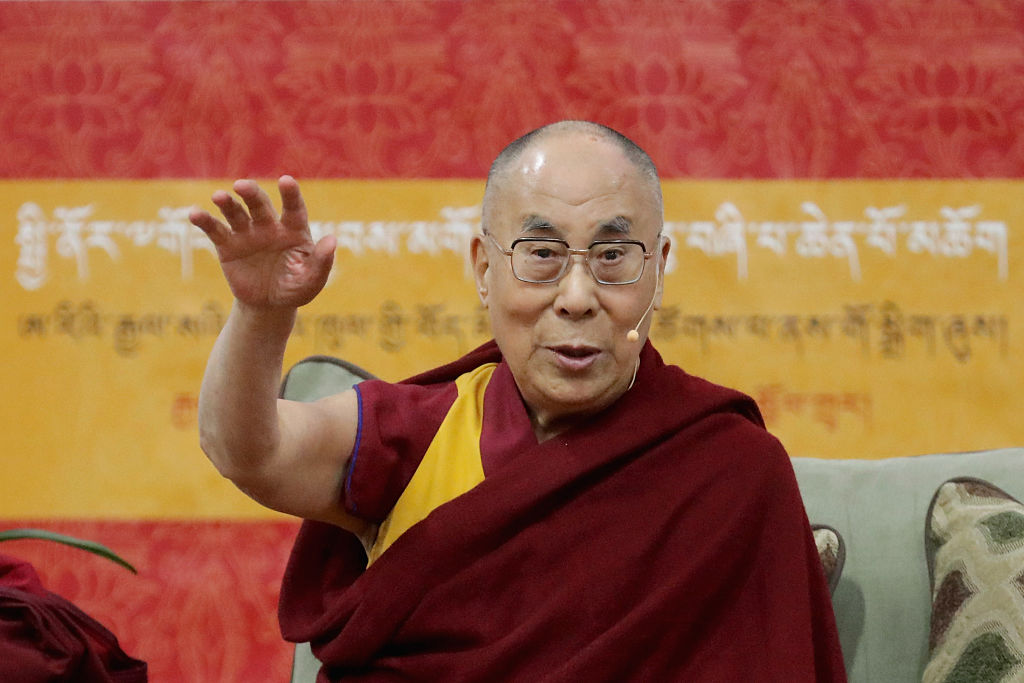 The Dalai Lama is welcomed by actor Richard Gere and House Minority Leader Nancy Pelosi (D-CA) before addressing followers and supporters during an event at the Bender Arena on the campus of American University June 13, 2016 in Washington, DC. The exiled