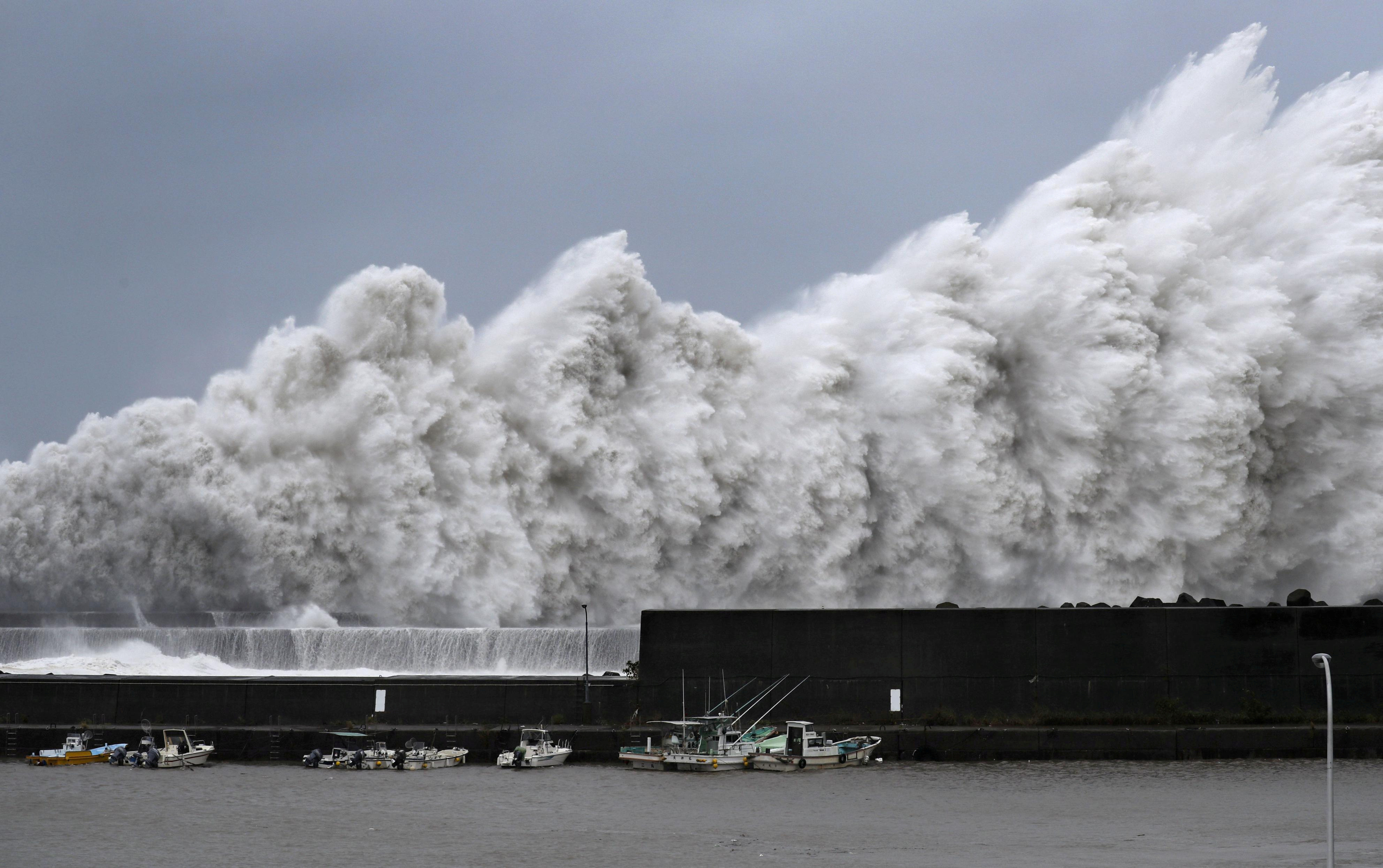 High waves triggered by Typhoon Jebi are seen at a fishing port in Aki