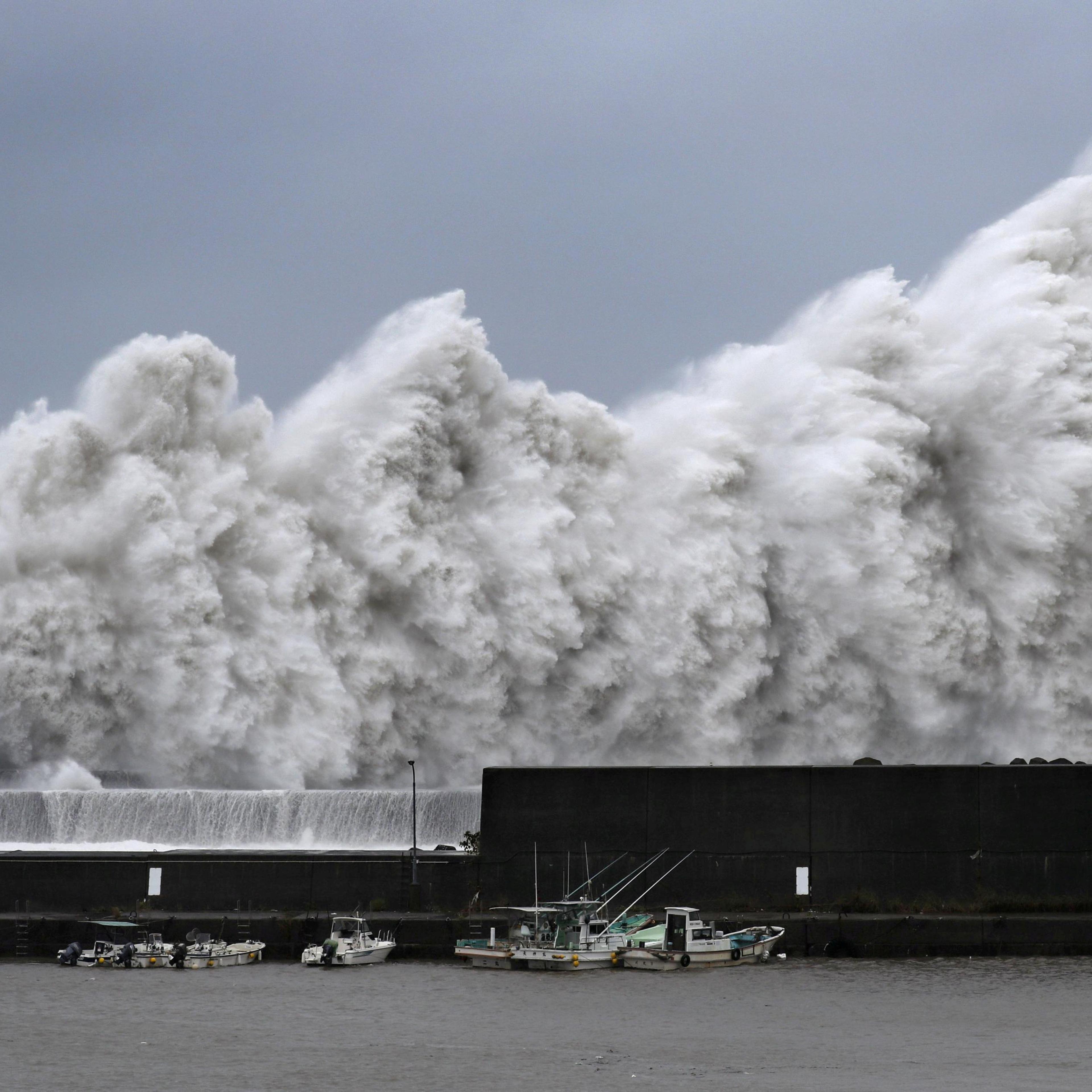 High waves triggered by Typhoon Jebi are seen at a fishing port in Aki