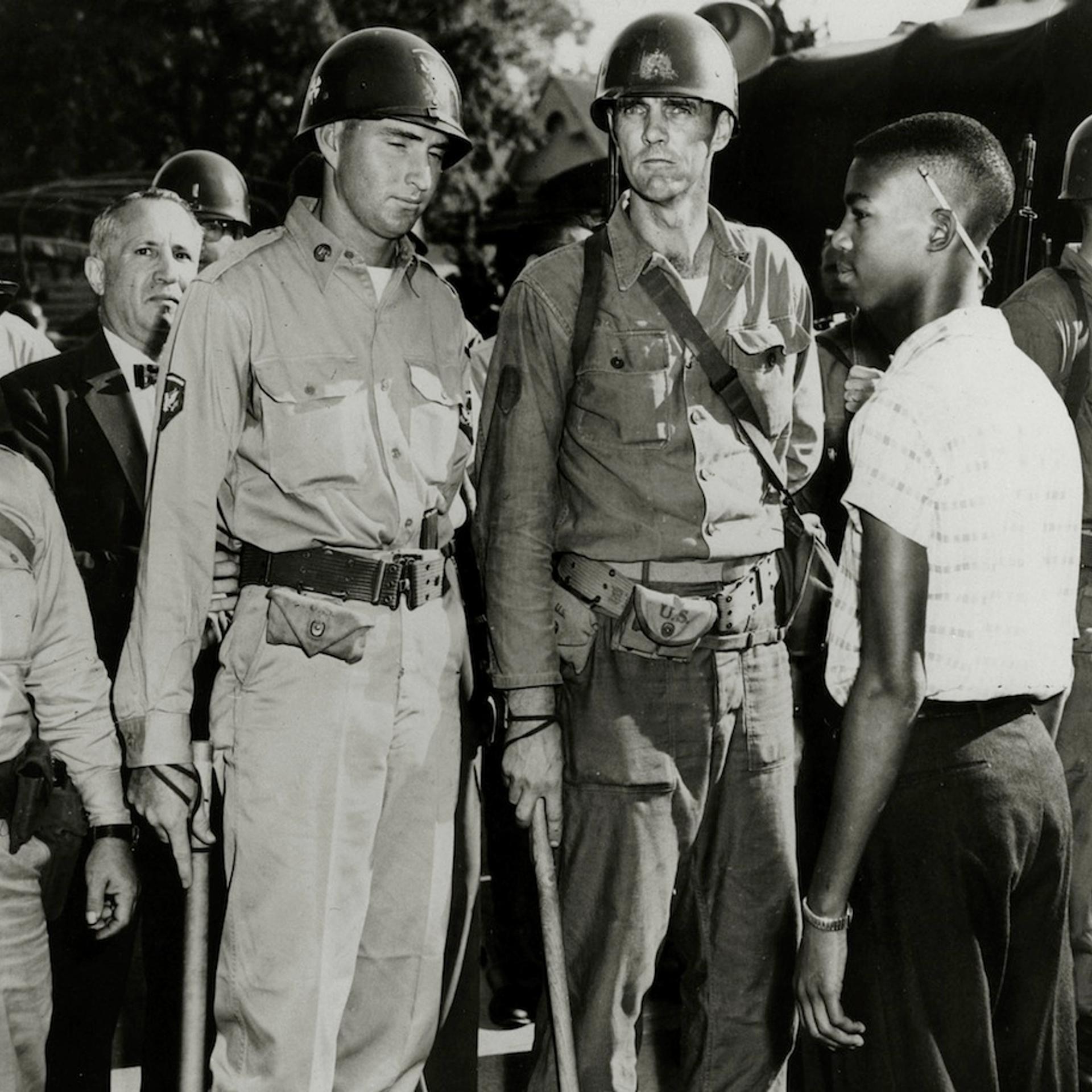 Education Segregation, USA. pic: circa 1957. Little Rock, Arkansas. National Guardsmen, having admitted white children to a school, barr the way to a black student.
