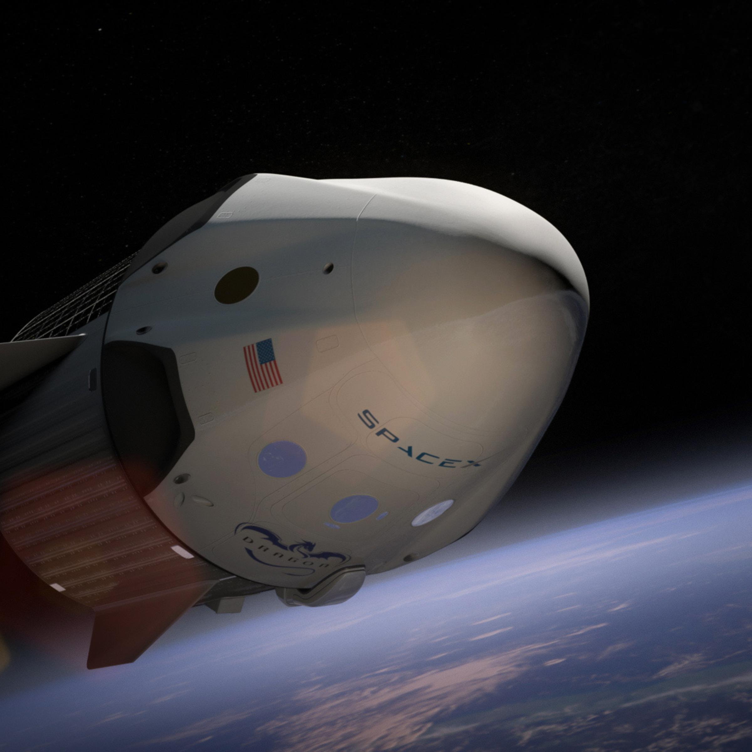 An artist's rendering of the Dragon V2 spacecraft in orbit. Elon Musk announced that in 2018 SpaceX will fly two private citizens to the moon in its Dragon spacecraft, Feb 27, 2017.