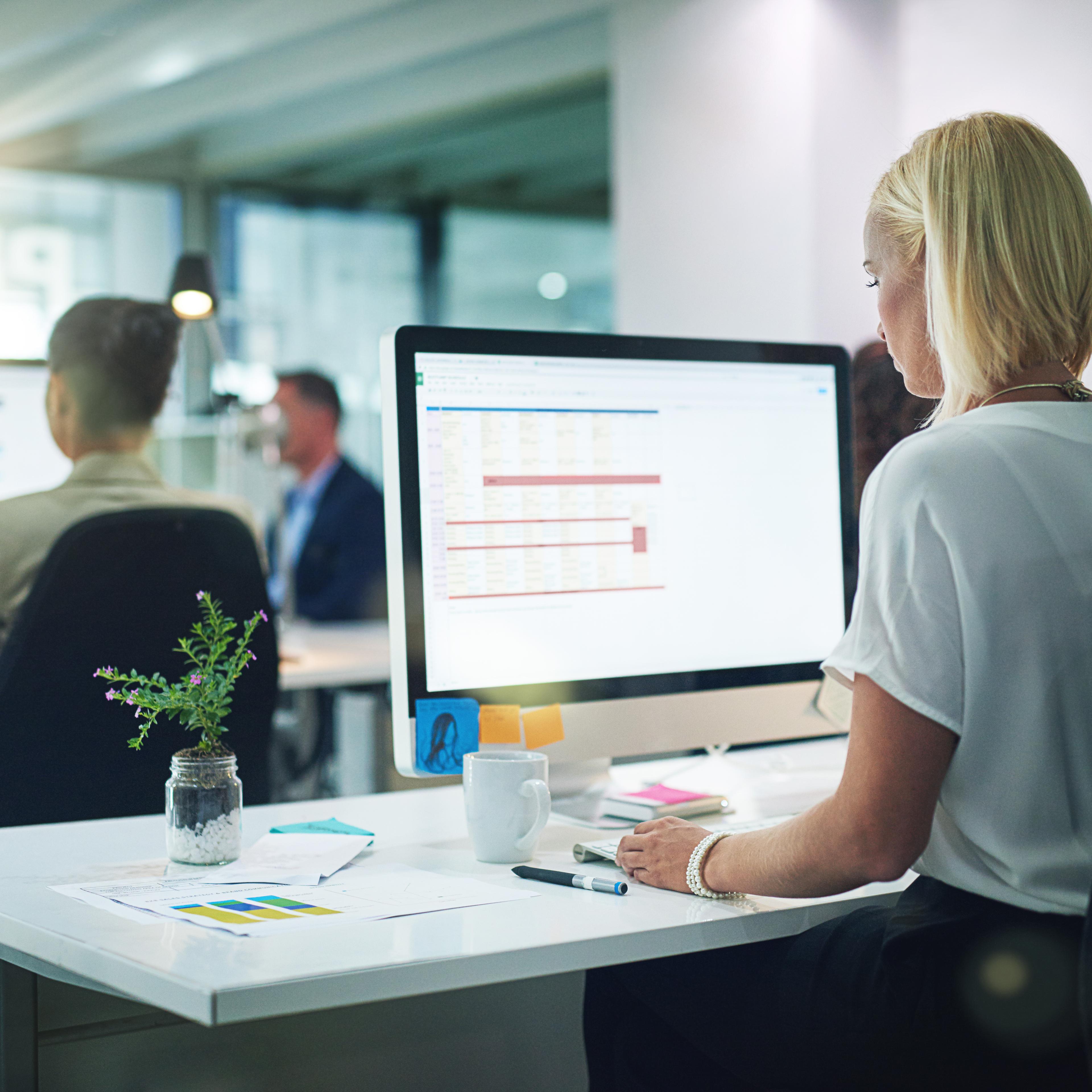 Cropped shot of a group of businesspeople working in the office