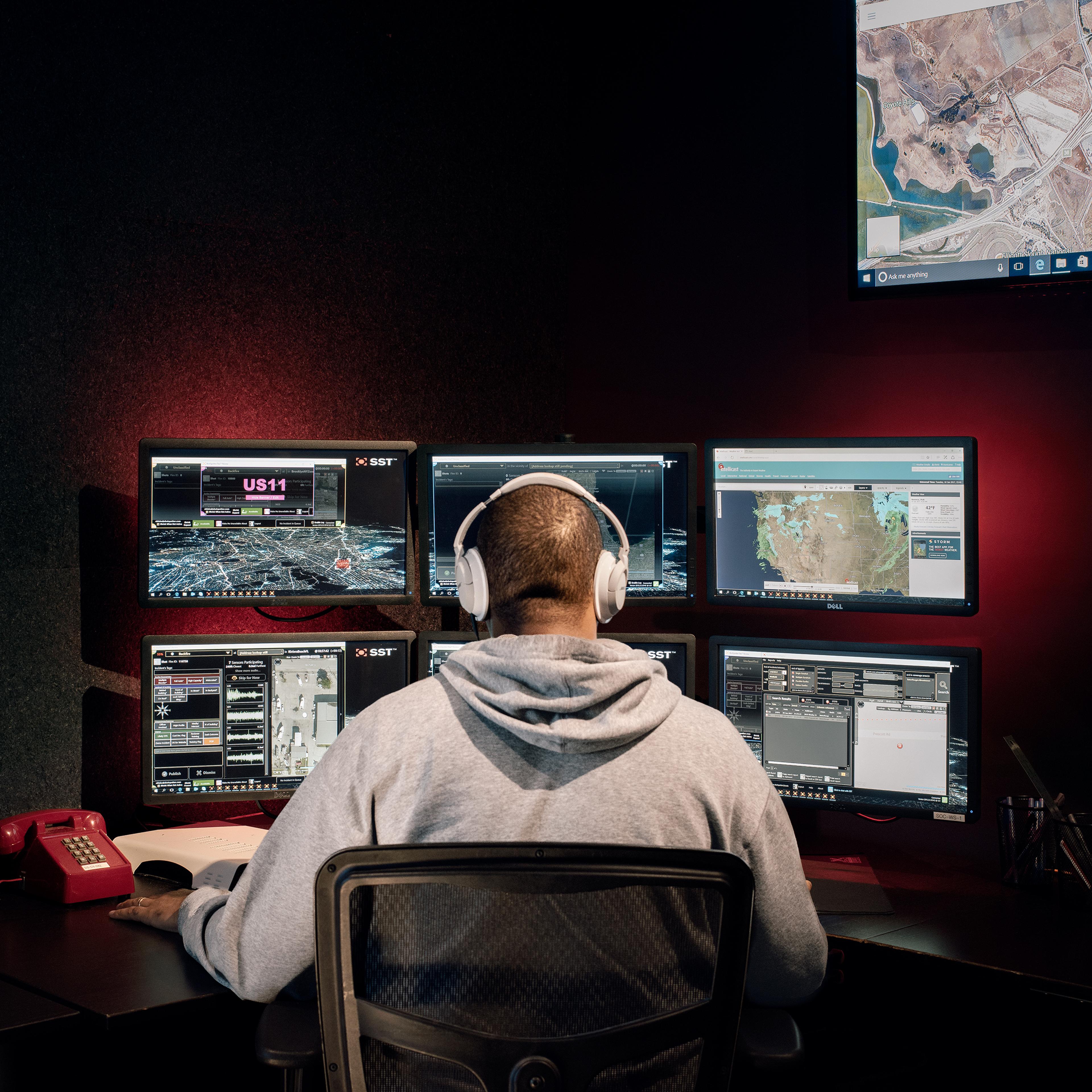 A ShotSpotter analyst reviews possible gunshots in real time at the company’s headquarters